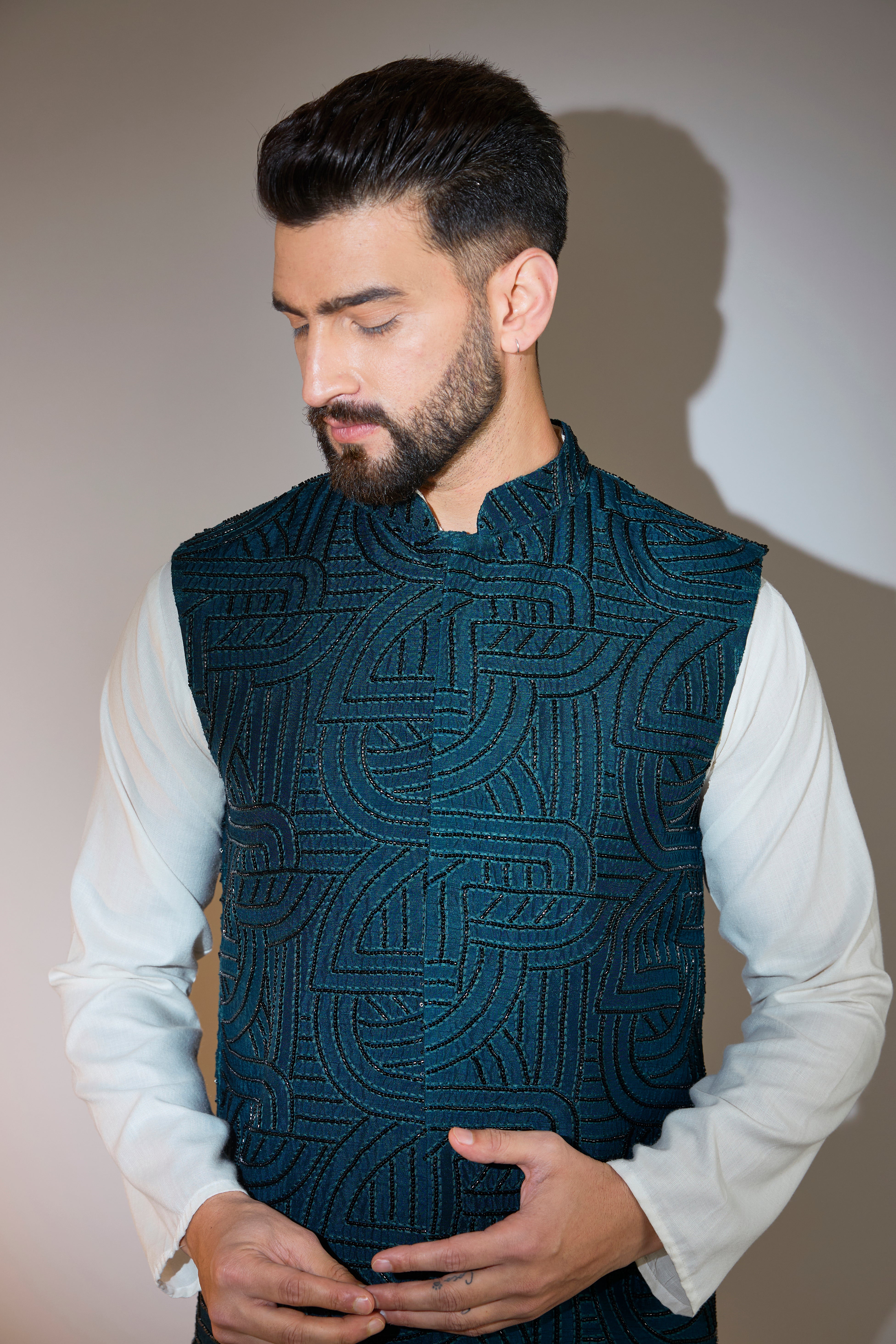 teal short jacket with intricate cut dana embroidery