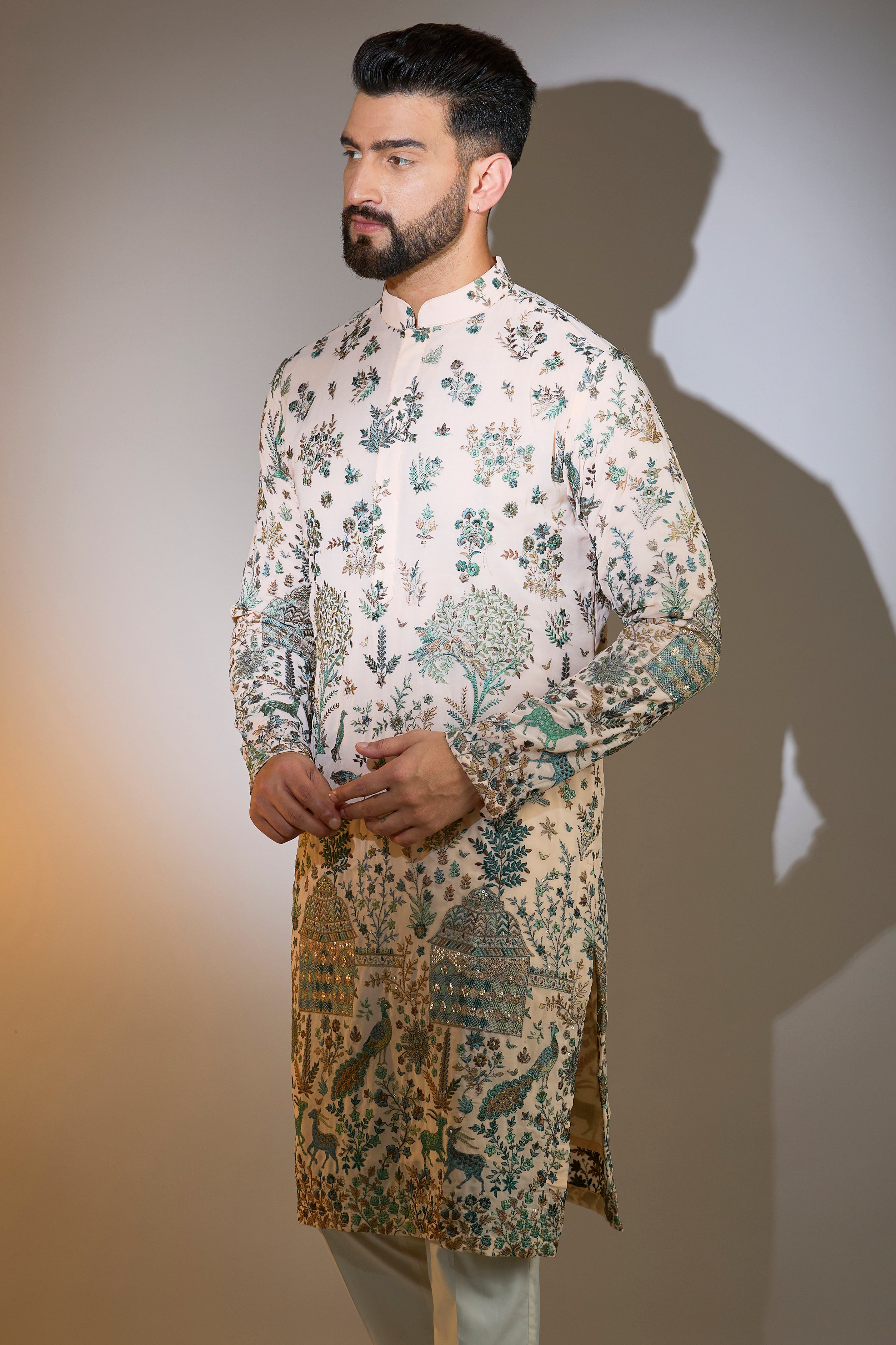 peach threadwork kurta with intricate flora and fauna motifs