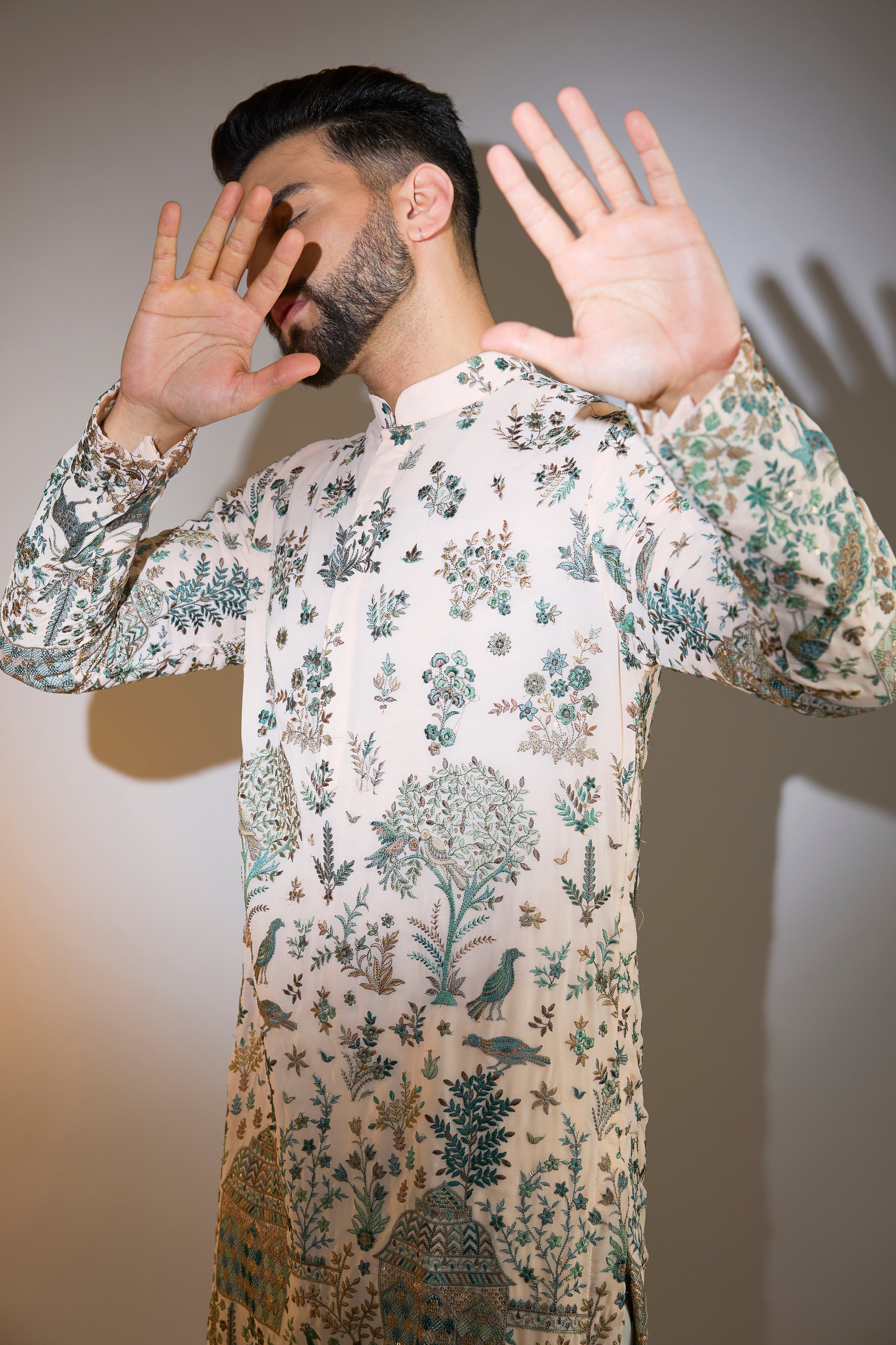 peach threadwork kurta with intricate flora and fauna motifs