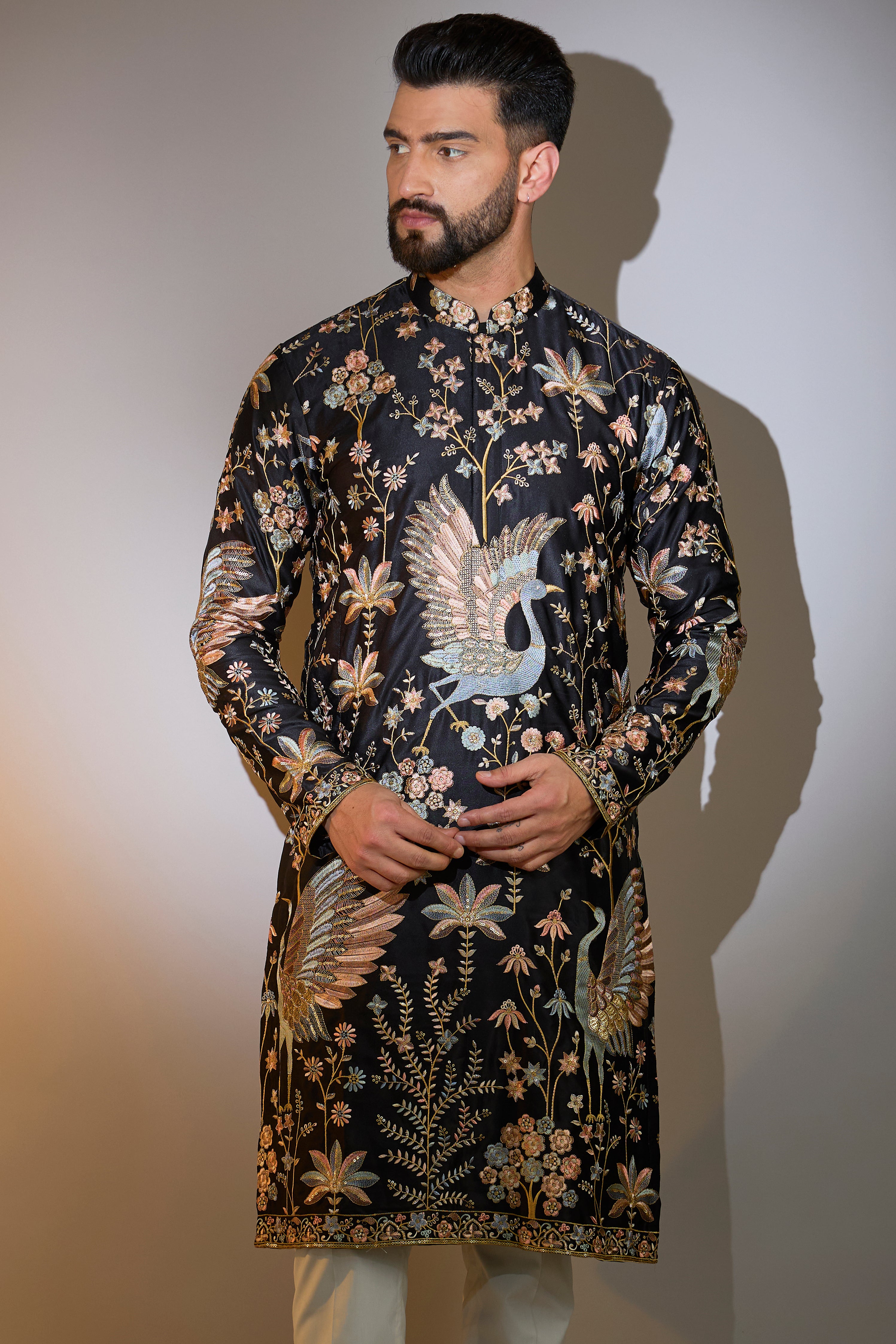 black thread work kurta with intricate flora and fauna embroidery