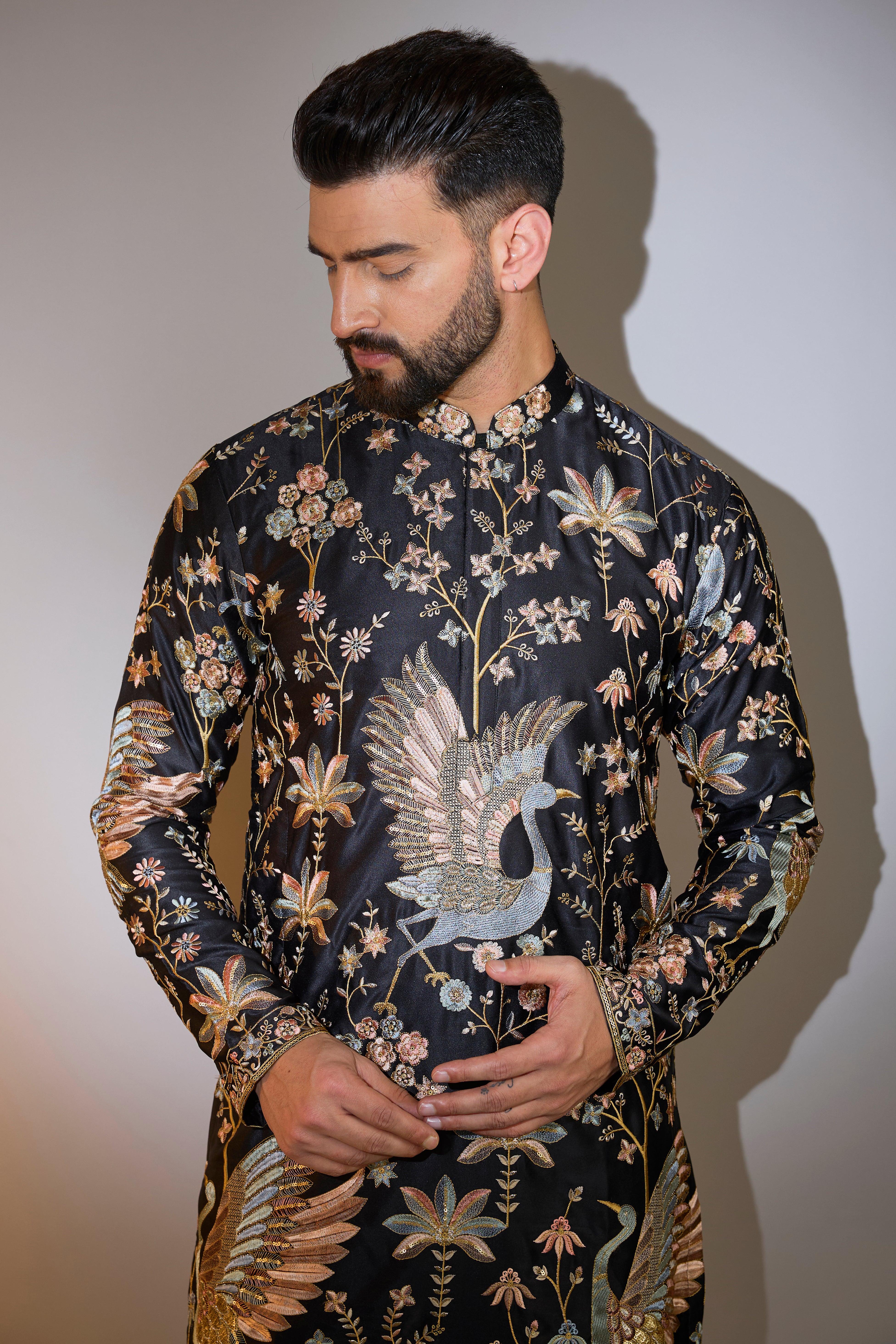 black thread work kurta with intricate flora and fauna embroidery
