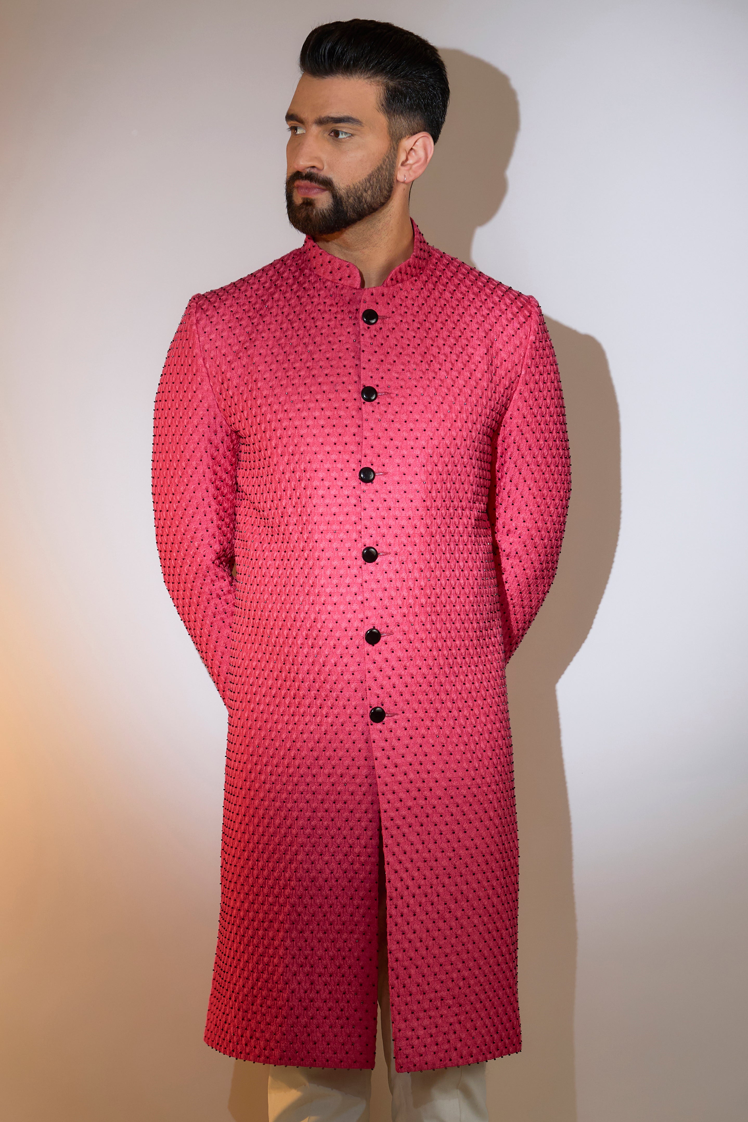 hot pink sherwani with intricate black cut dana work