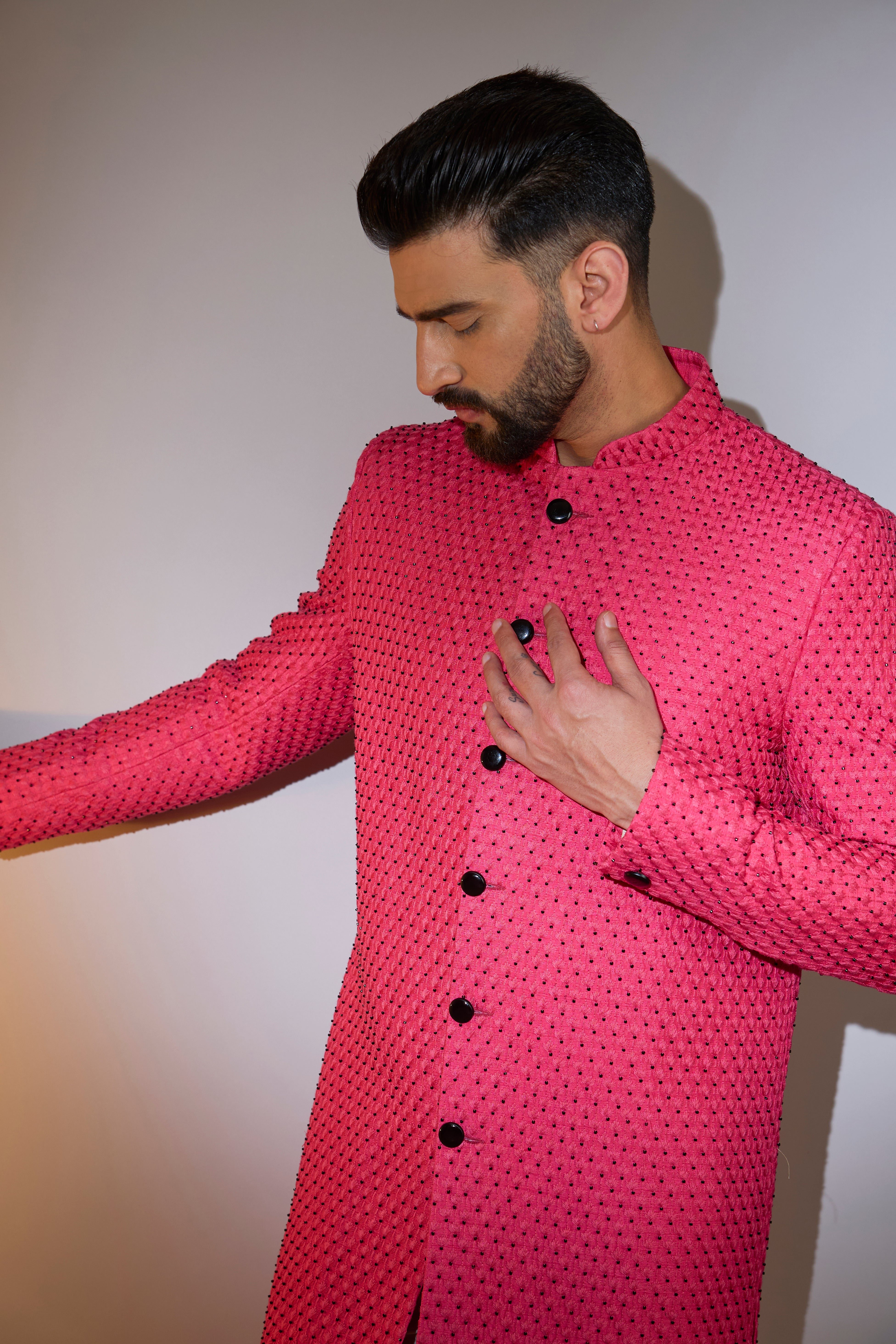 hot pink sherwani with intricate black cut dana work