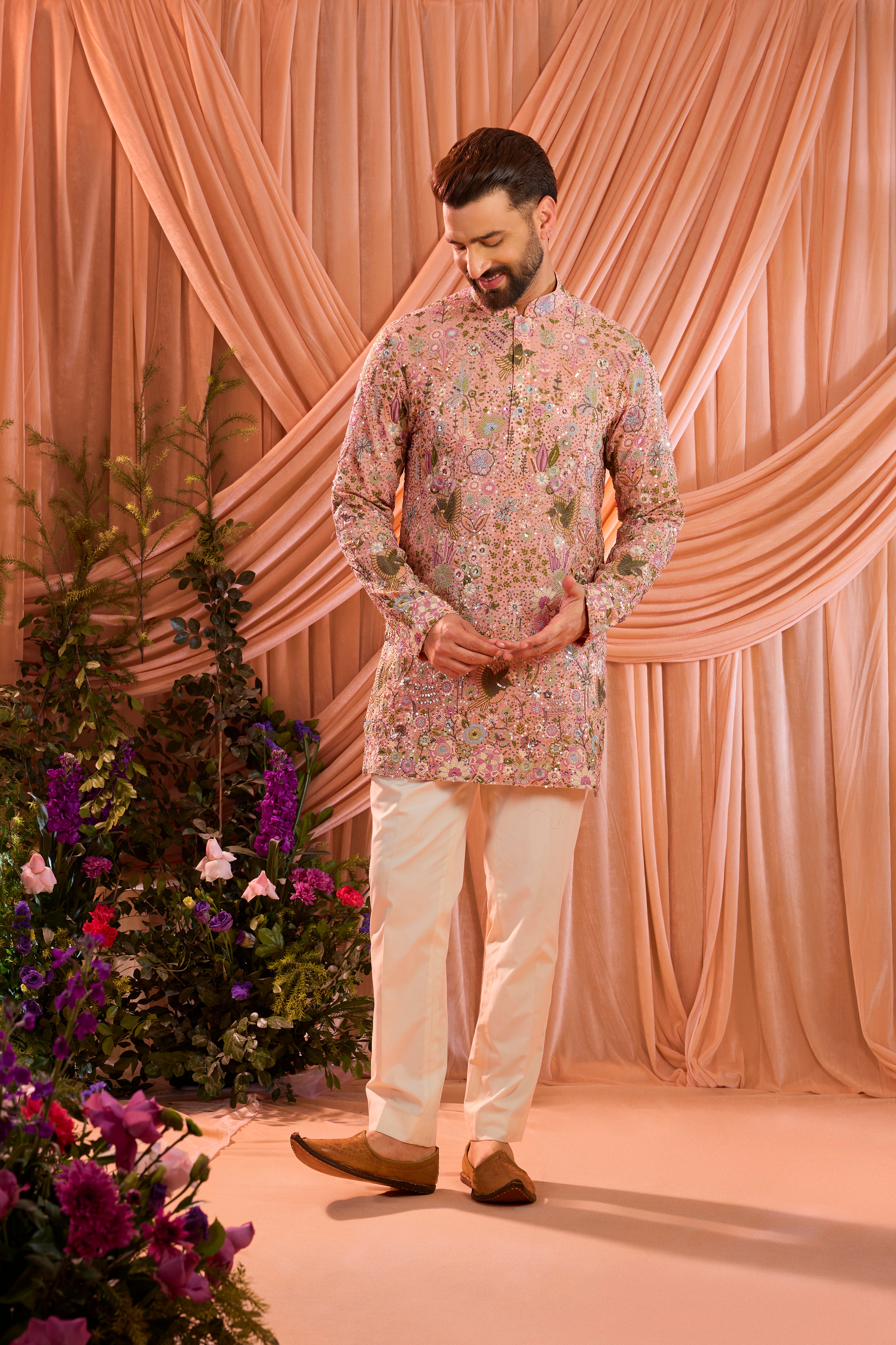 Pink sequined kurta with detailed flora and fauna figures and multi thread work