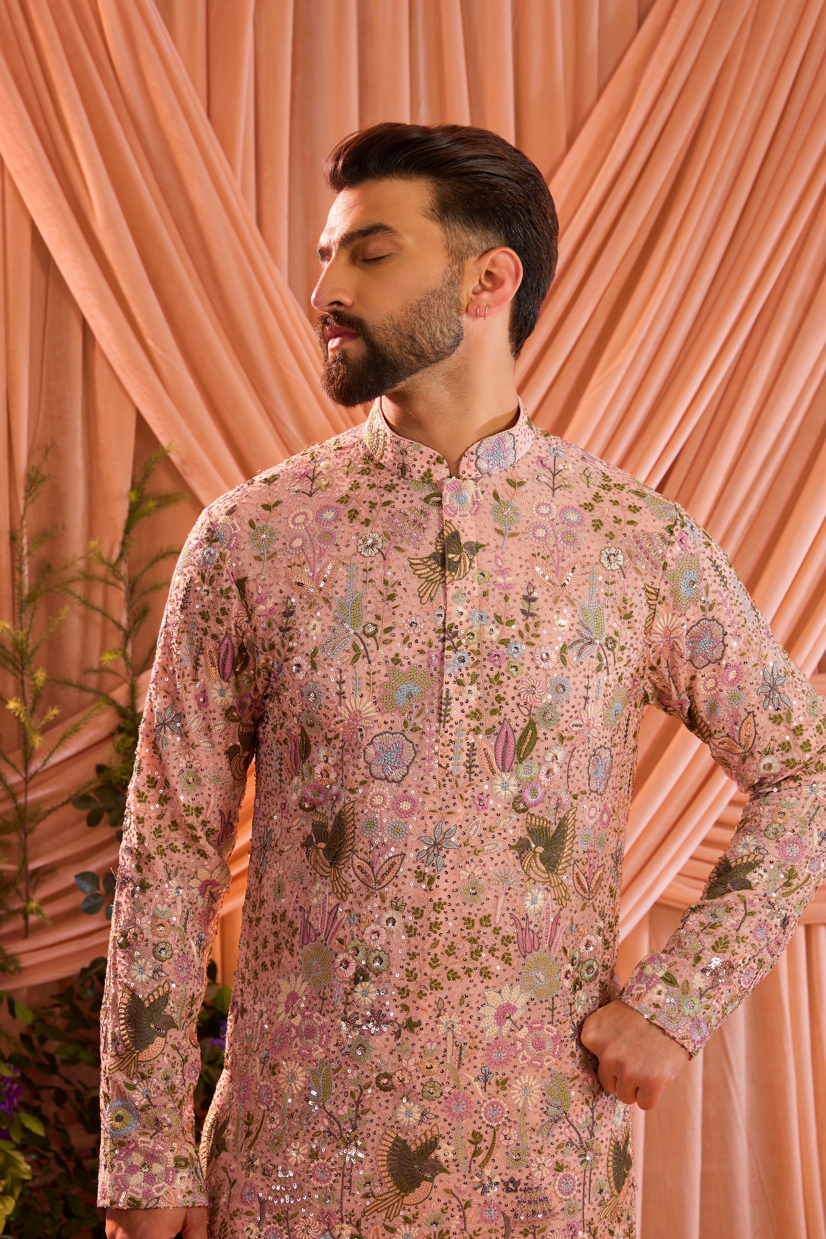 Pink sequined kurta with detailed flora and fauna figures and multi thread work