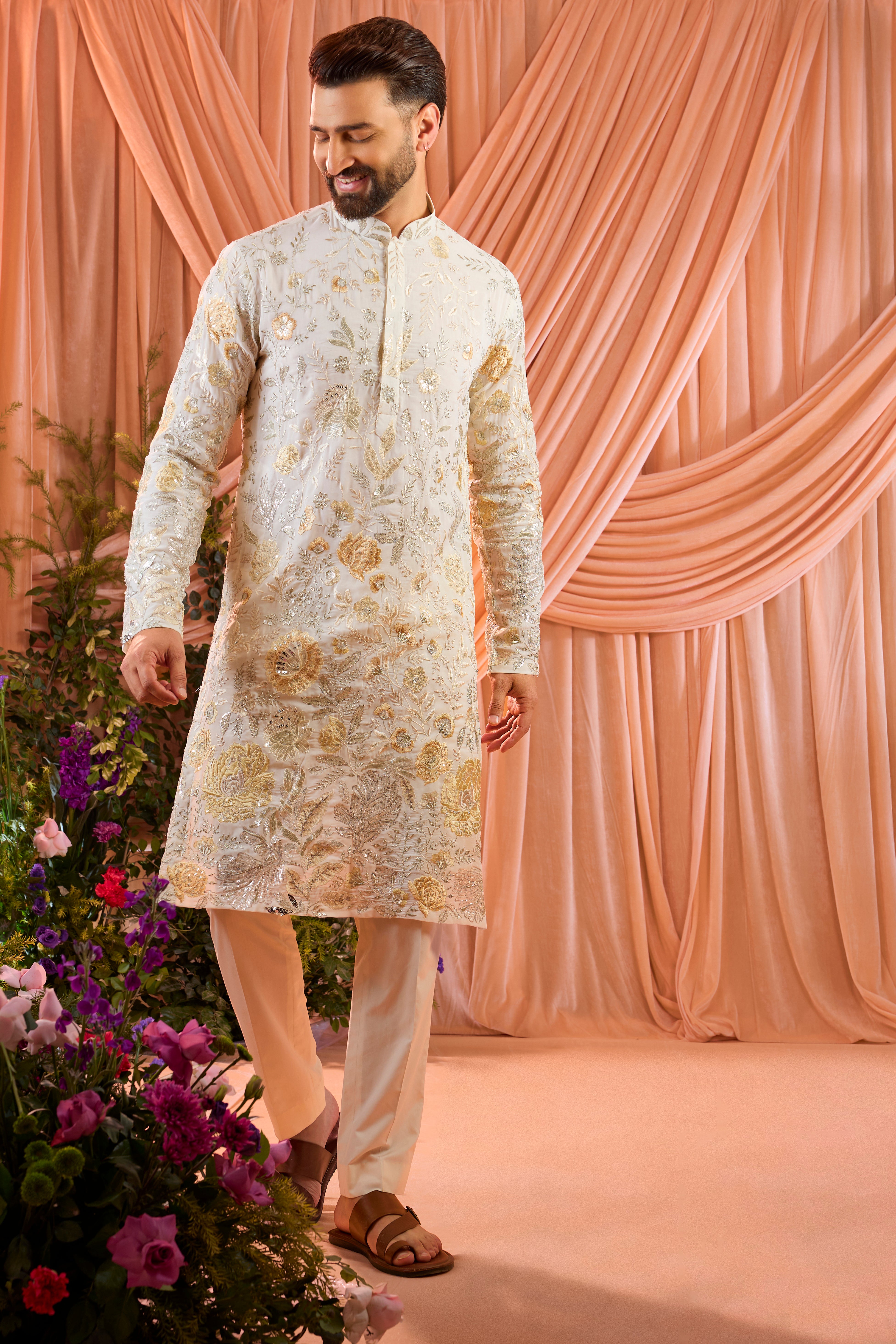 White floral kurta adorned with intricate multi-thread embroidery and subtle sequin highlights.