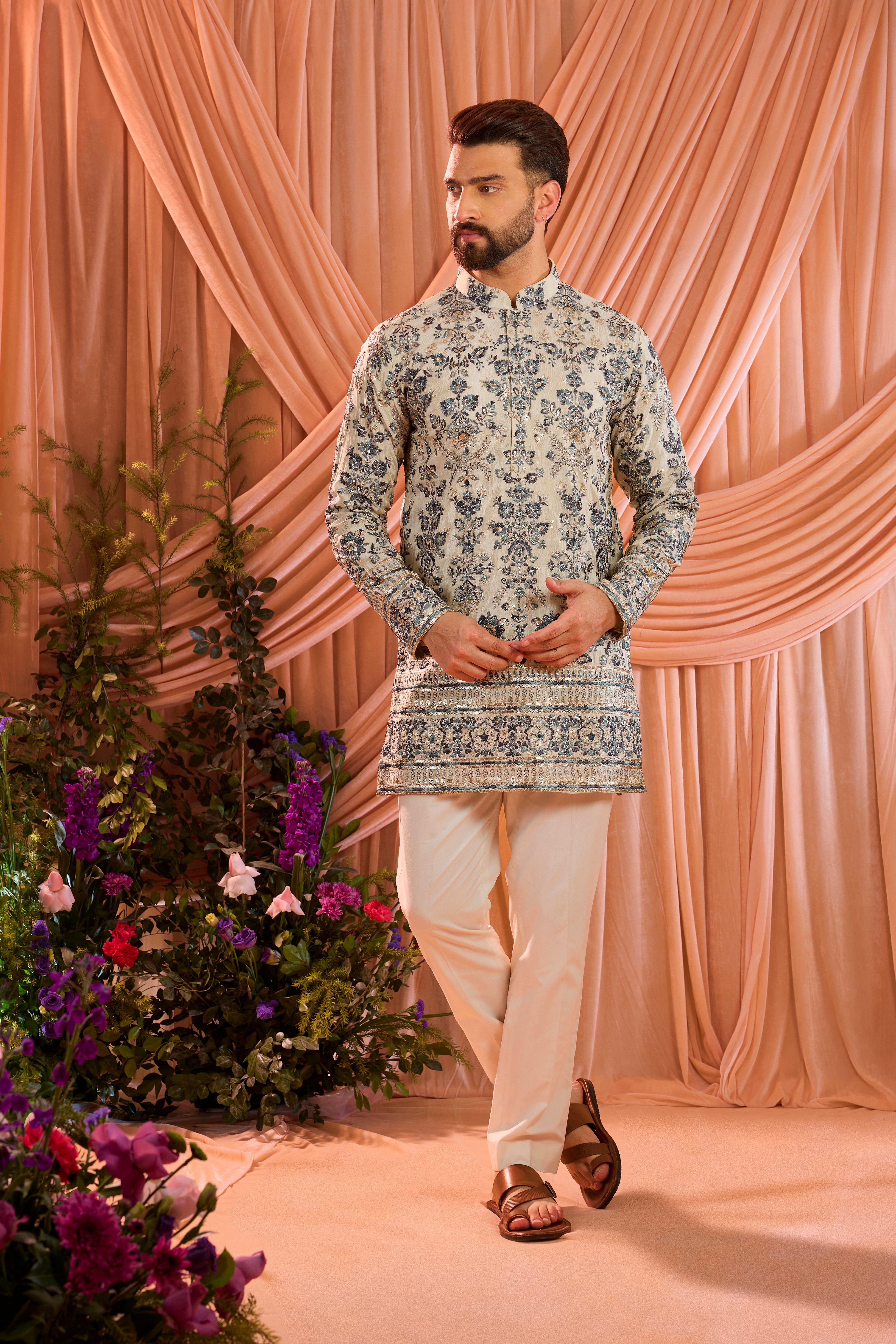 Light golden short floral chikankari kurta with blue threadwork