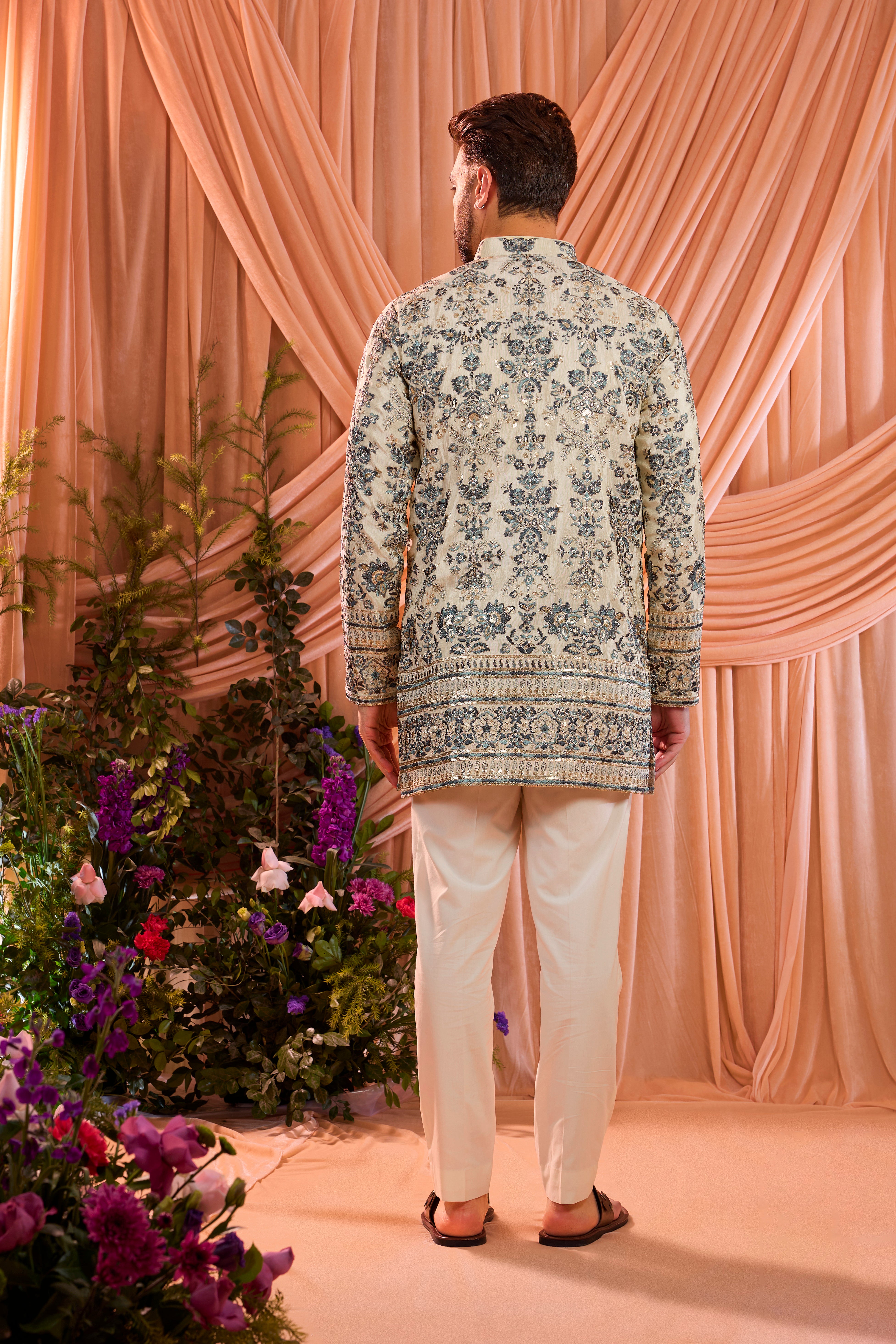 Light golden short floral chikankari kurta with blue threadwork