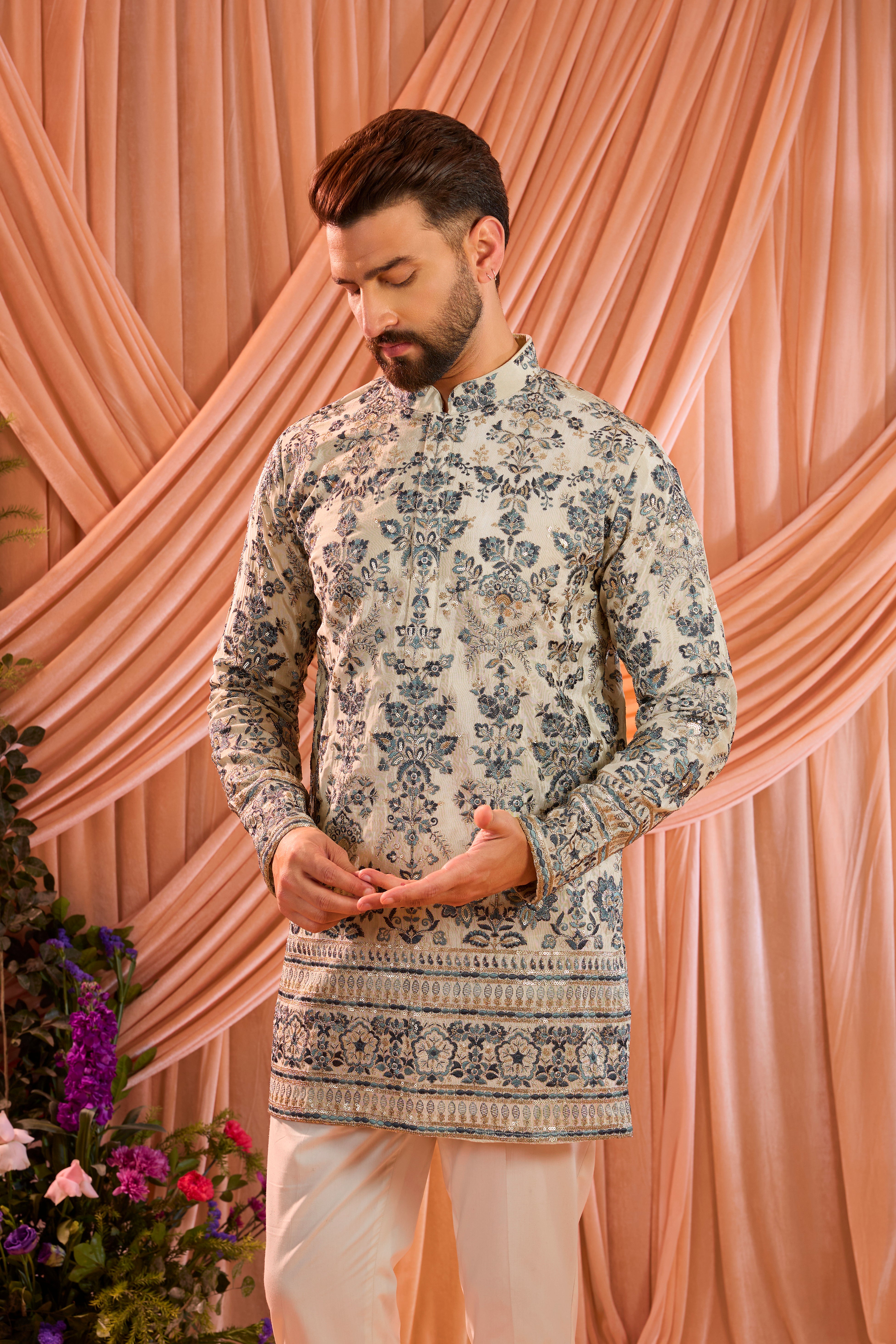 Light golden short floral chikankari kurta with blue threadwork