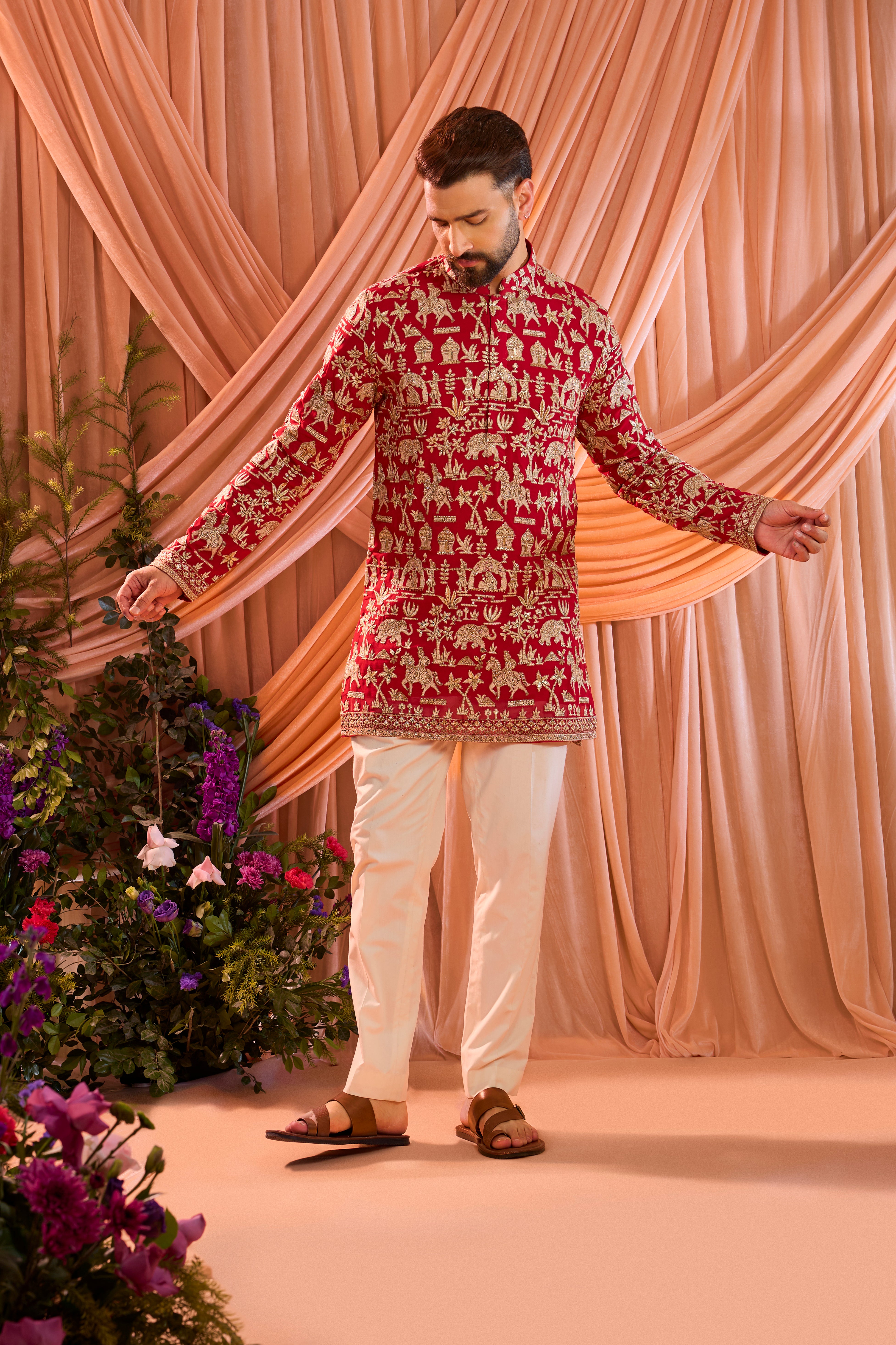 Hot pink royal-heritage kurta adorned with intricately detailed Mughal-era motifs, reflecting the grandeur of imperial artistry.