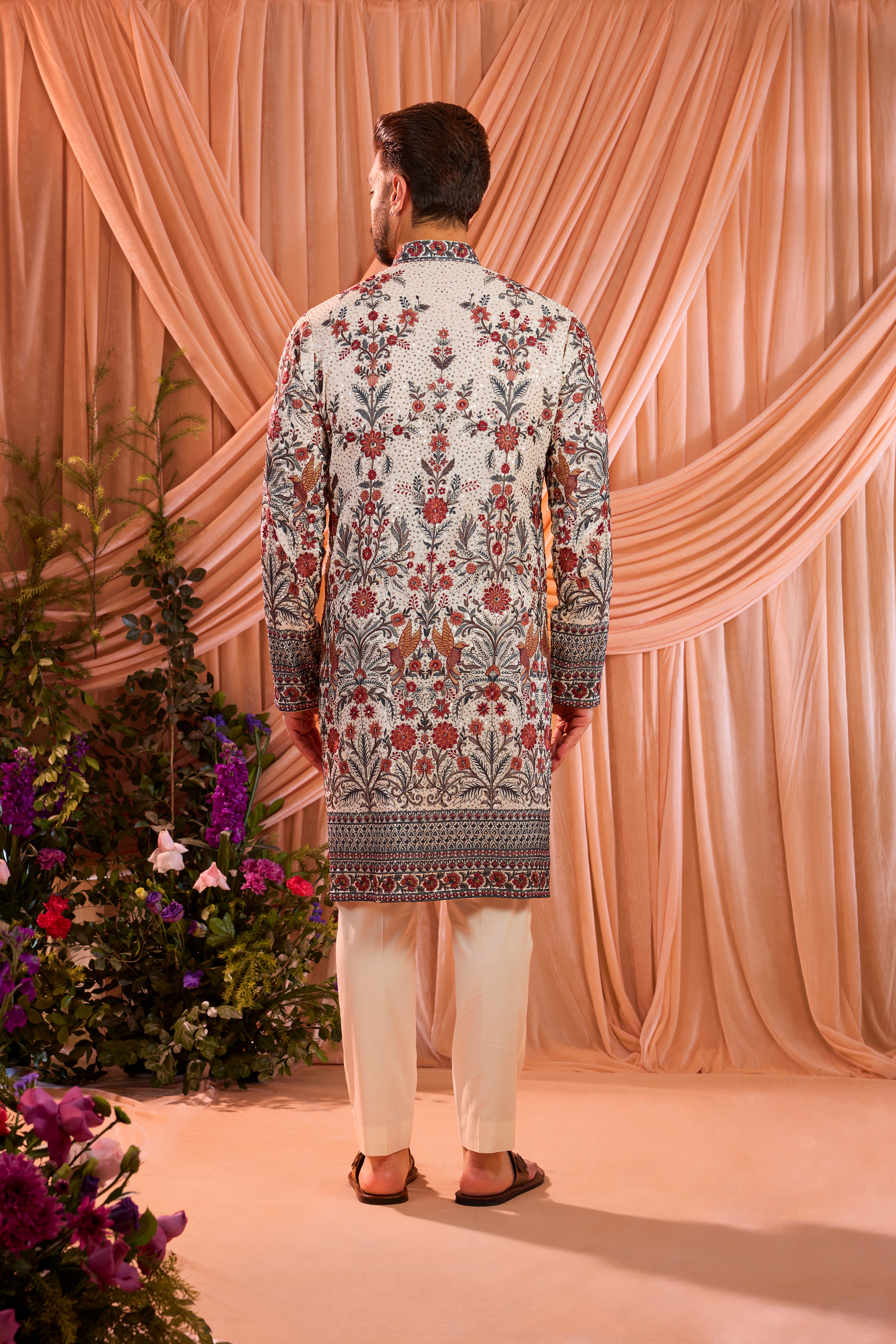 White chikankari kurta with detailed floral embroidery and sequin