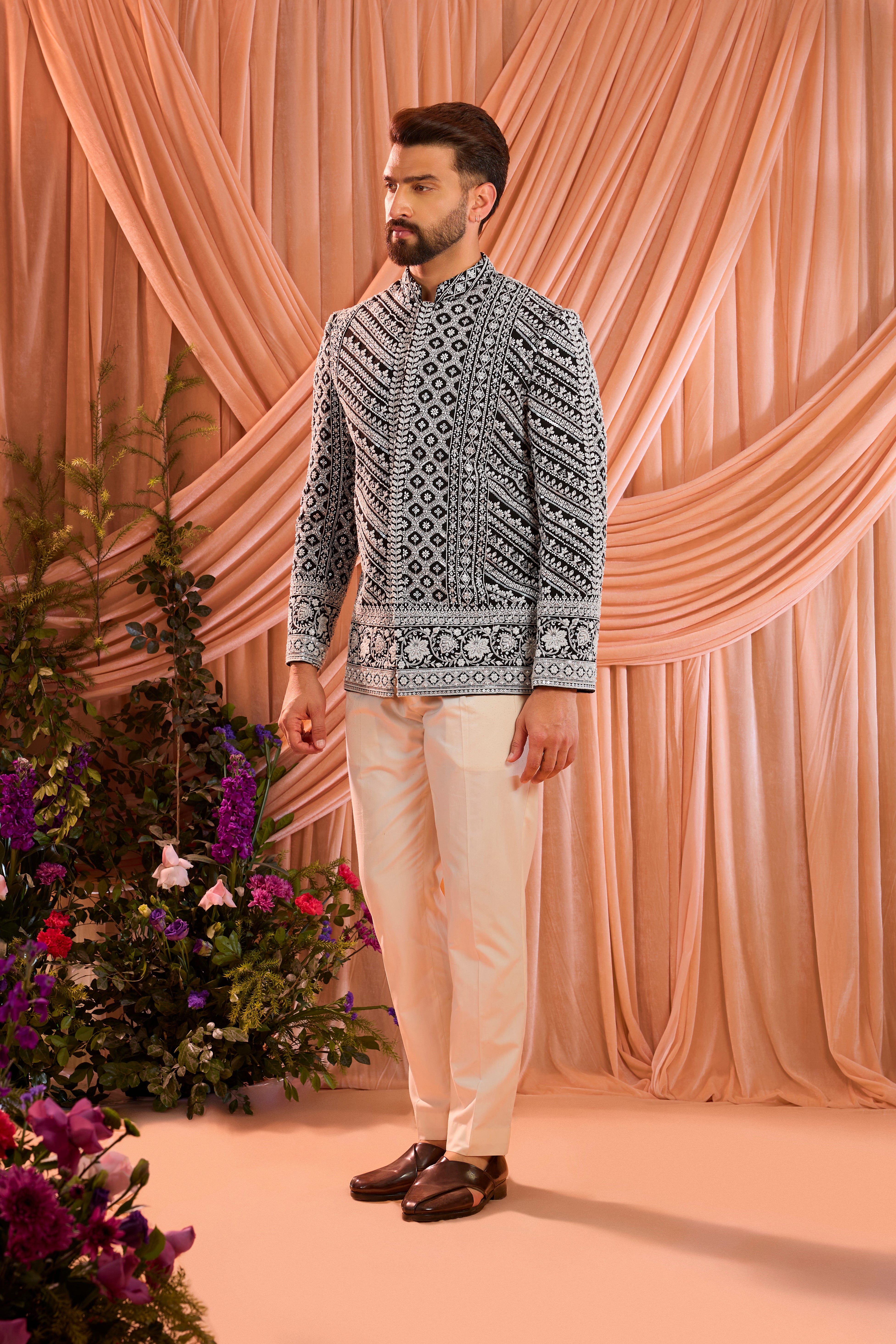 Black hand-embroidered formal bandgala jacket , exquisitely adorned with intricate ivory cut-dana detailing.