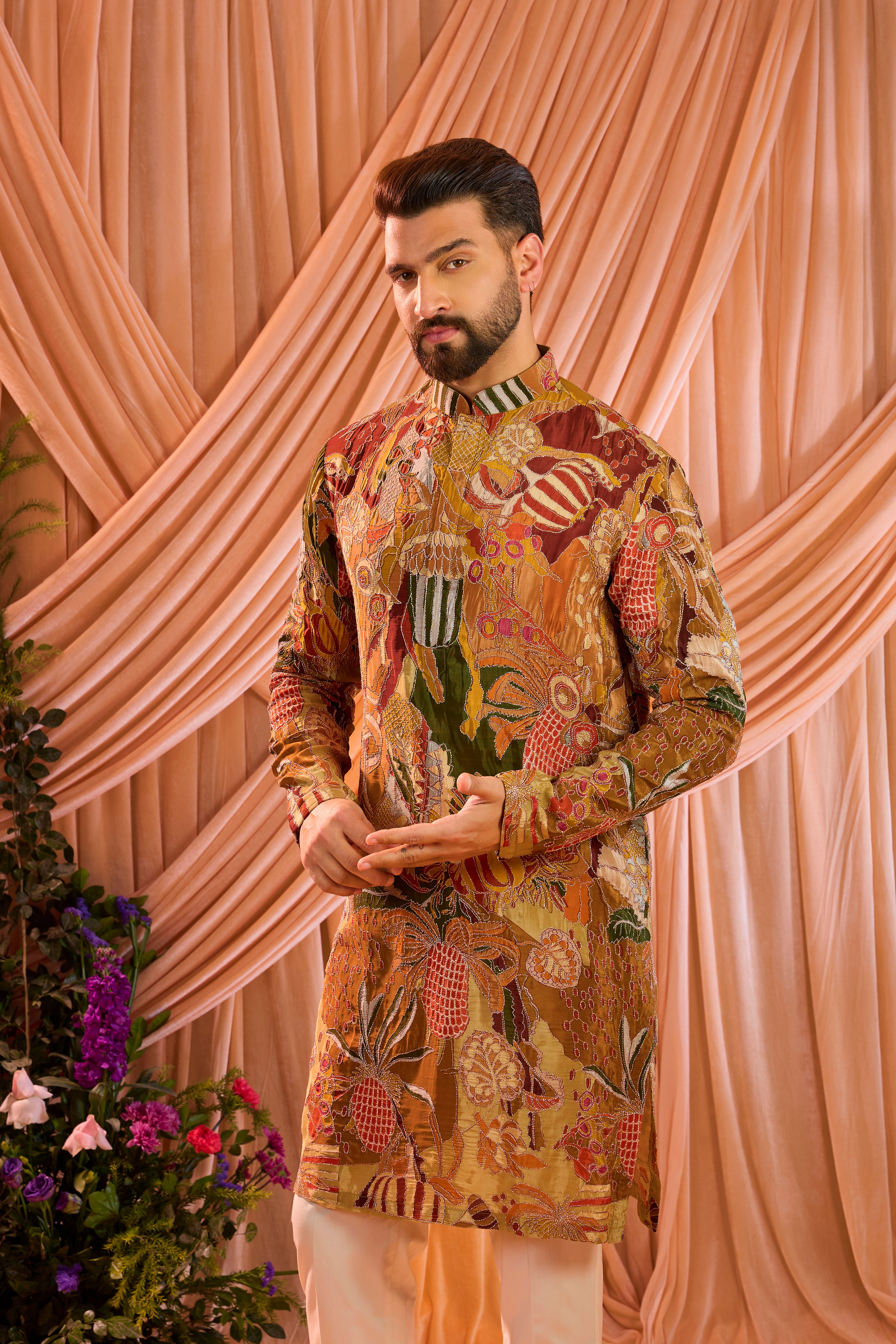 A multicoloured abstract kurta crafted on fluid crepe, elevated with meticulously detailed zari work.