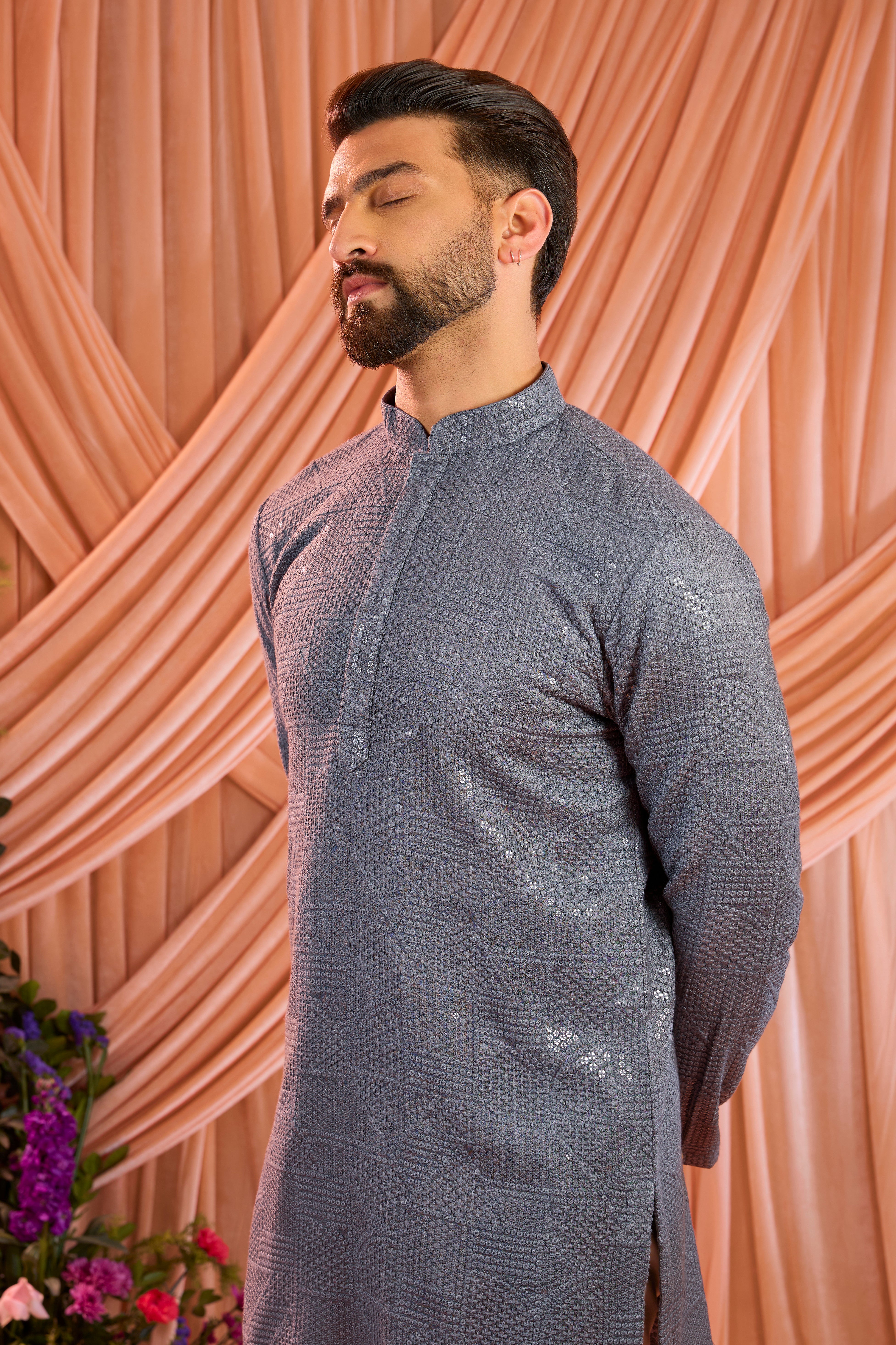 A slate grey kurta elevated with heavy sequin embellishment arranged in an abstract design.
