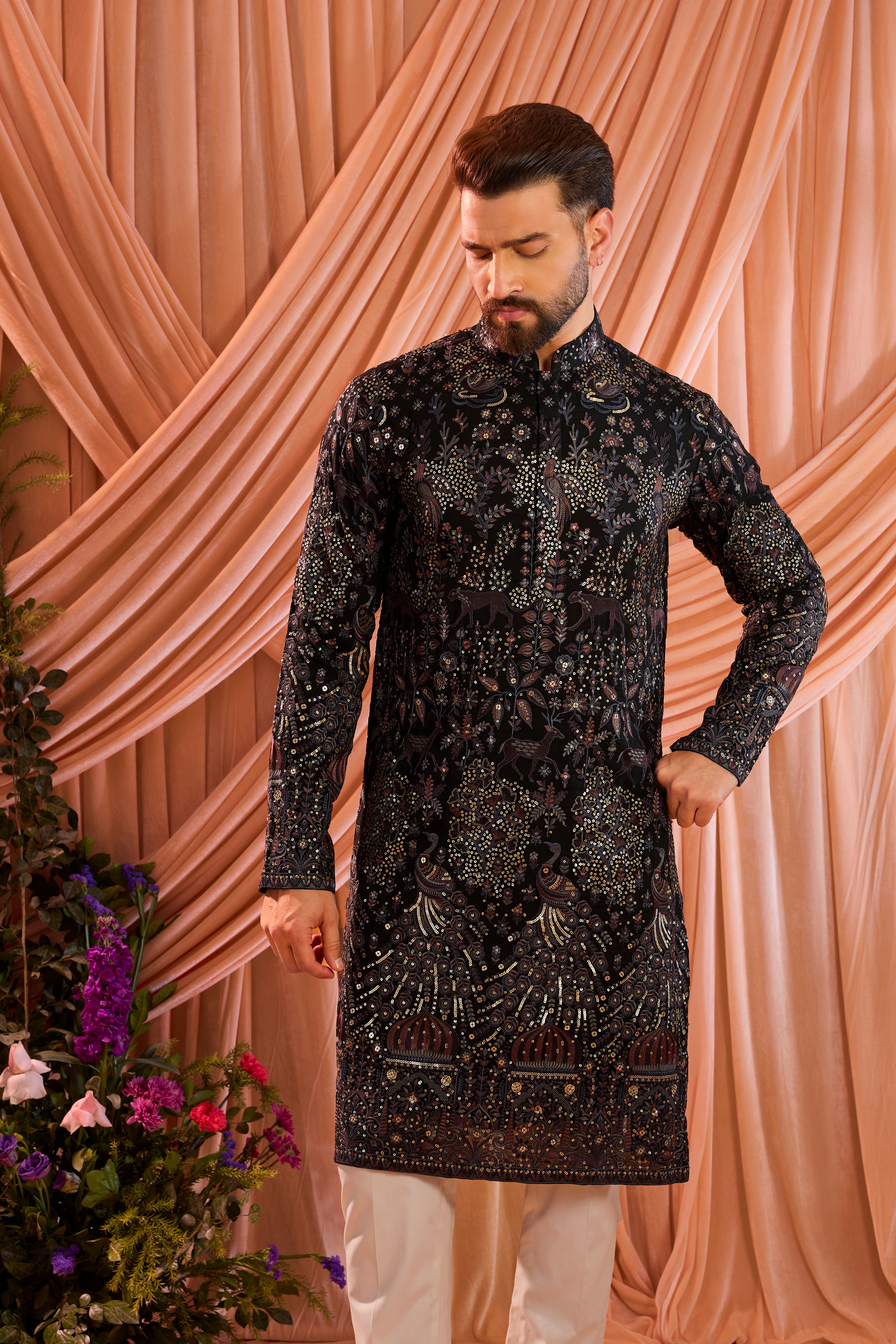 A blue/multi coloured royal heritage kurta adorned with detailed flora and fauna motifs and intricate darbar scenes.