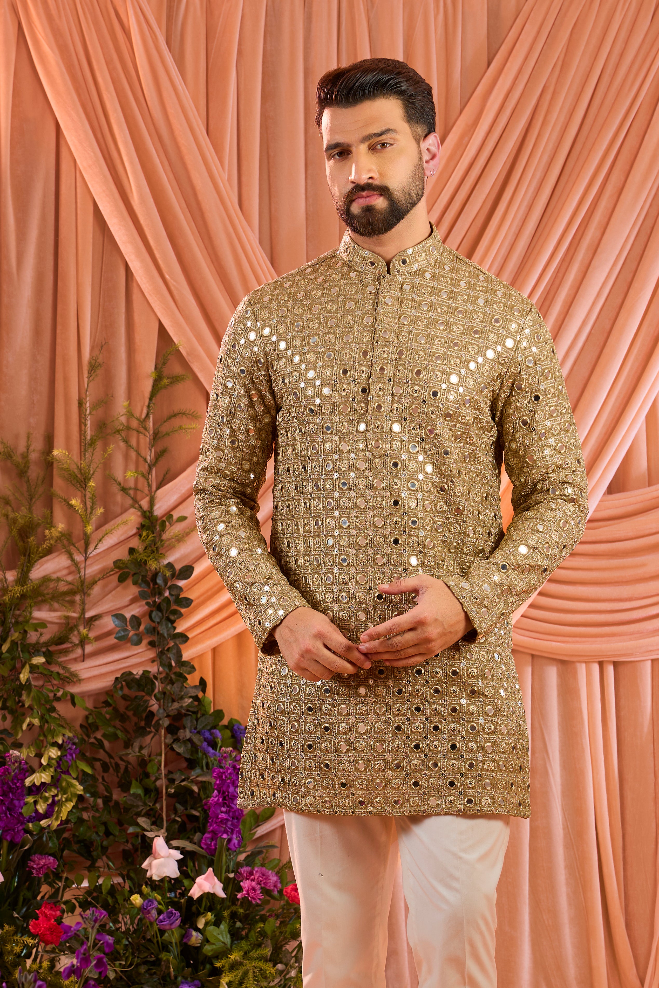 A copper short kurta featuring mirror-inspired sequin work that captures the brilliance of traditional mirror craftsmanship