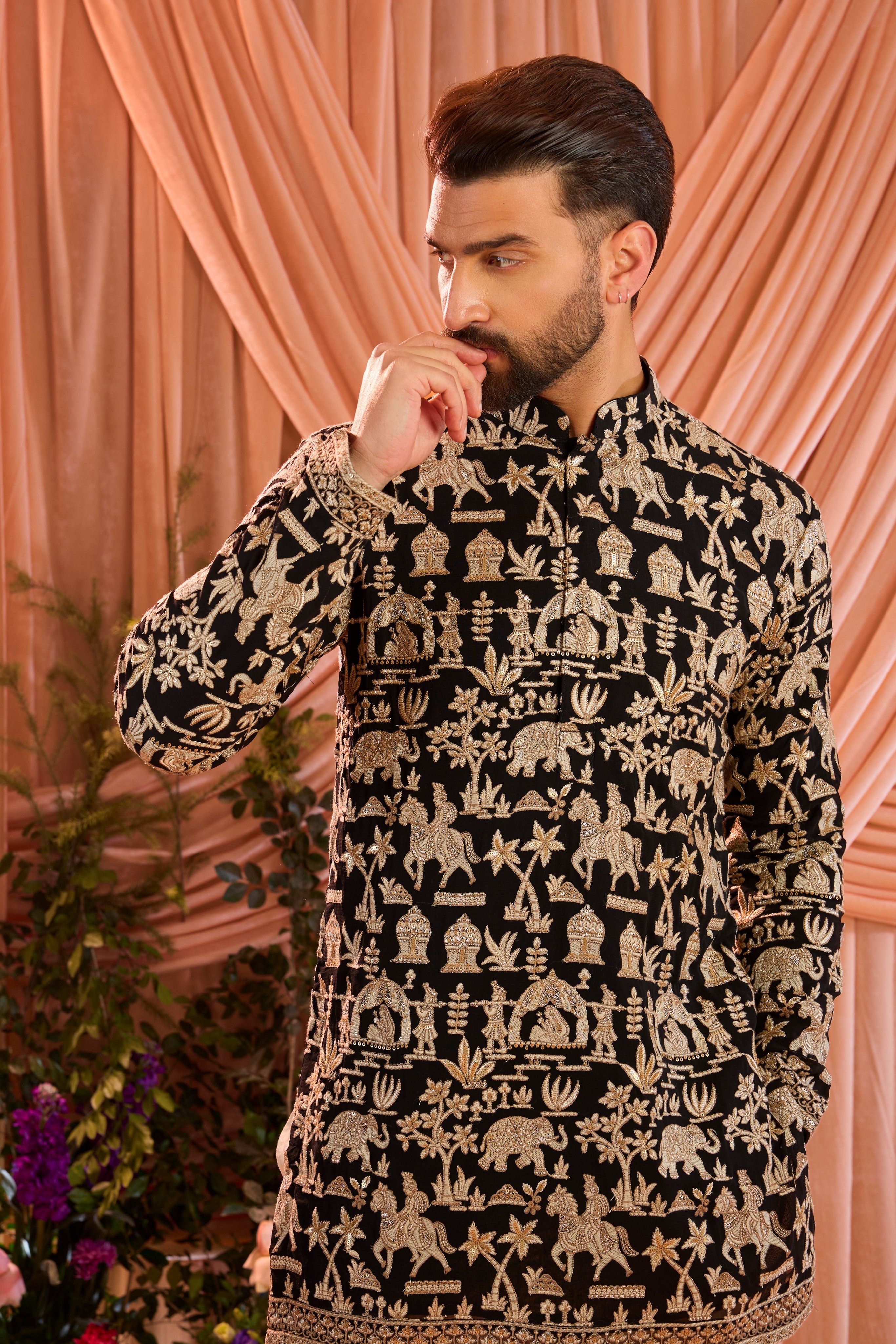 Black royal-heritage kurta adorned with intricately detailed Mughal-era motifs, reflecting the grandeur of imperial artistry.