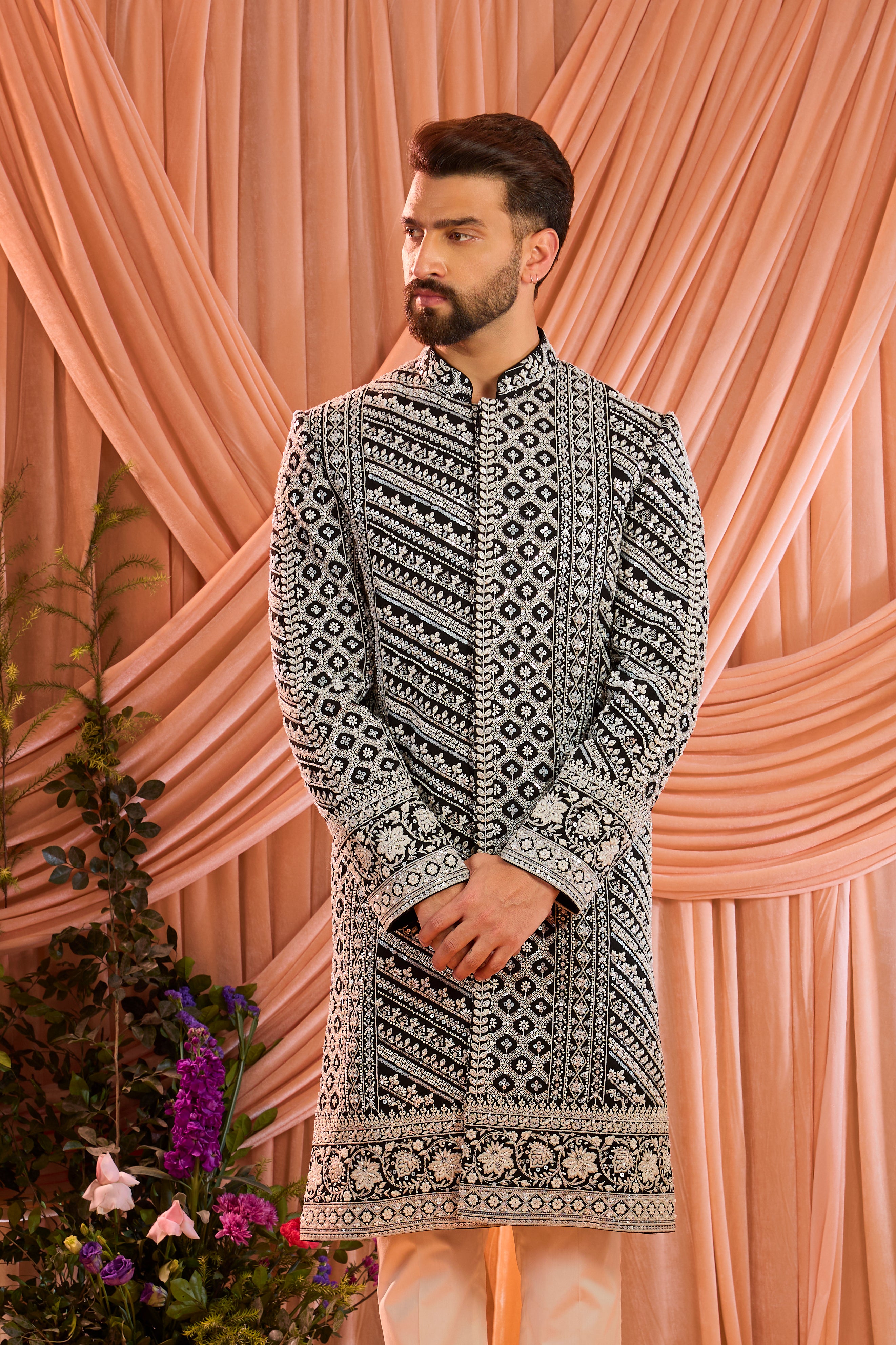 Black hand-embroidered formal sherwani , exquisitely adorned with intricate ivory cut-dana detailing.