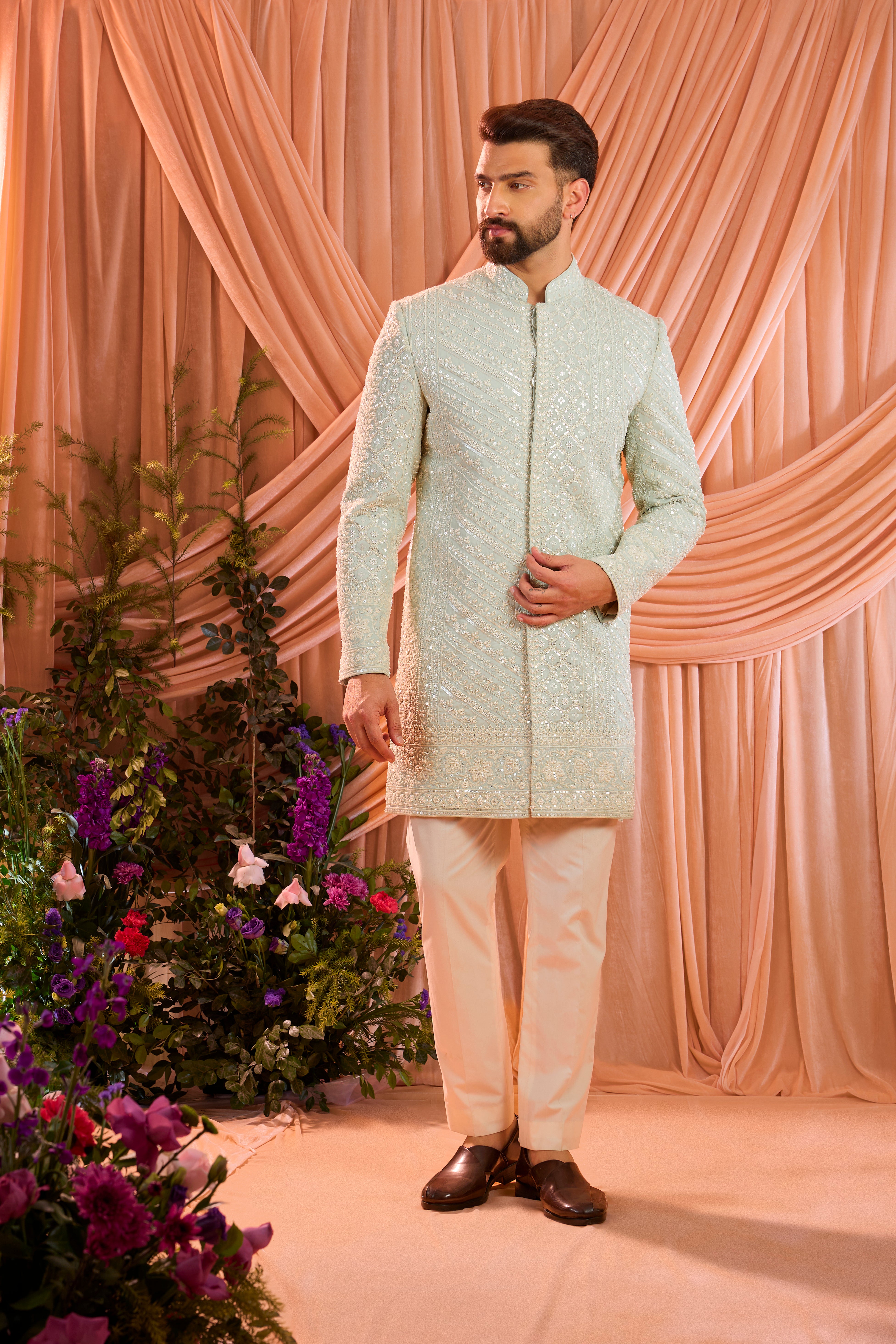 Aqua blue hand-embroidered formal sherwani, exquisitely adorned with intricate ivory cut-dana detailing.