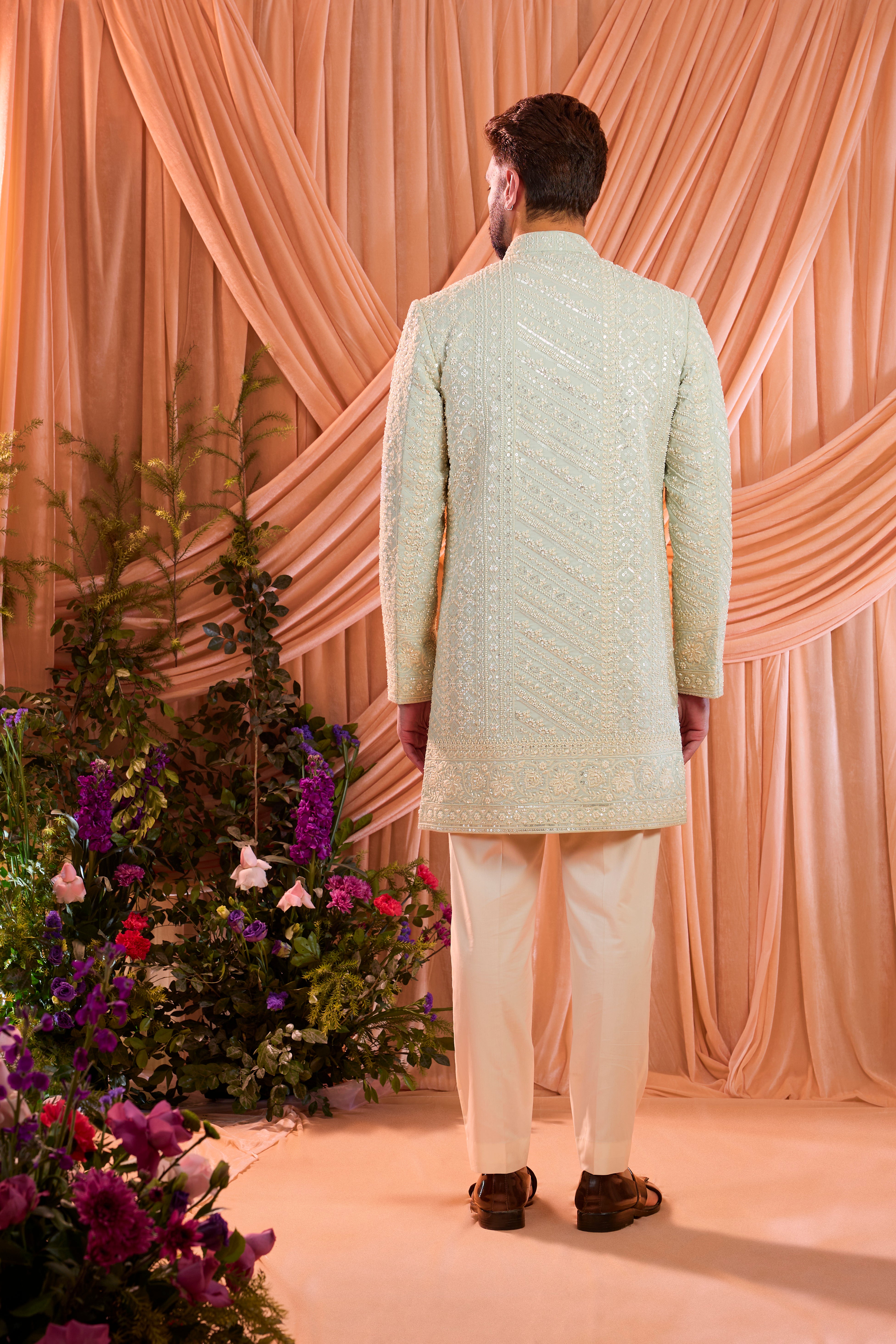 Aqua blue hand-embroidered formal sherwani, exquisitely adorned with intricate ivory cut-dana detailing.