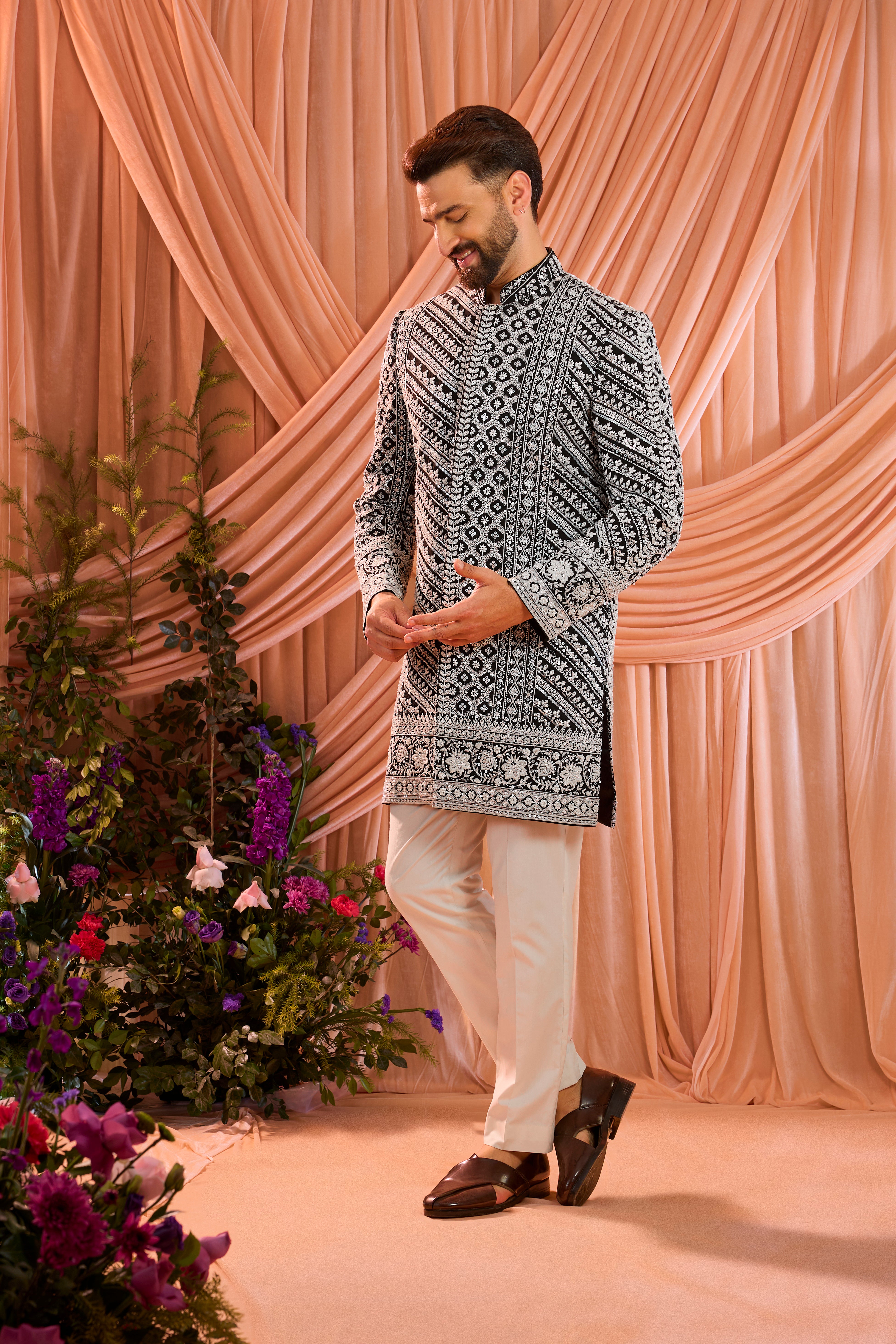 Black hand-embroidered formal short sherwani , exquisitely adorned with intricate ivory cut-dana detailing.