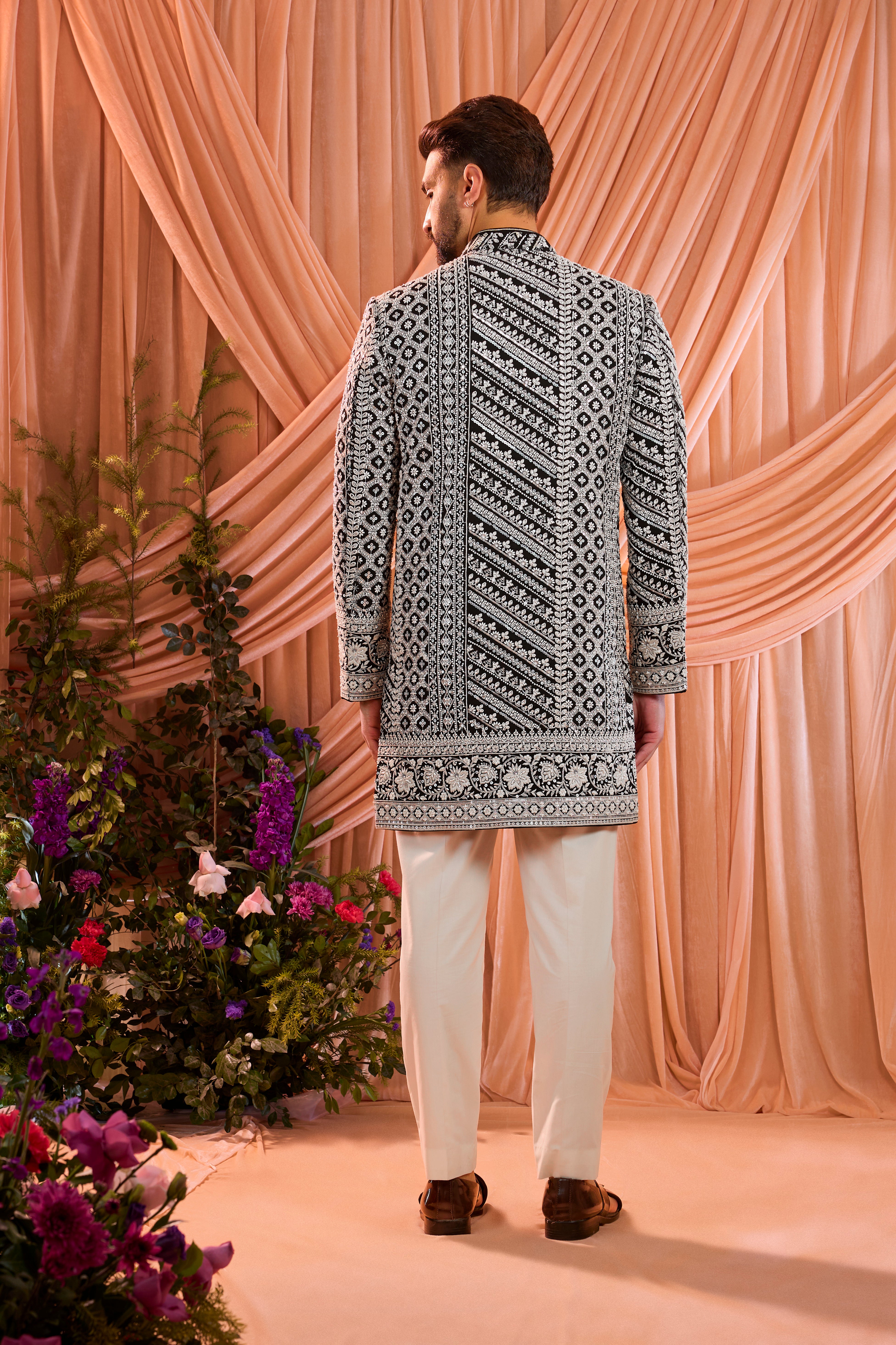 Black hand-embroidered formal short sherwani , exquisitely adorned with intricate ivory cut-dana detailing.