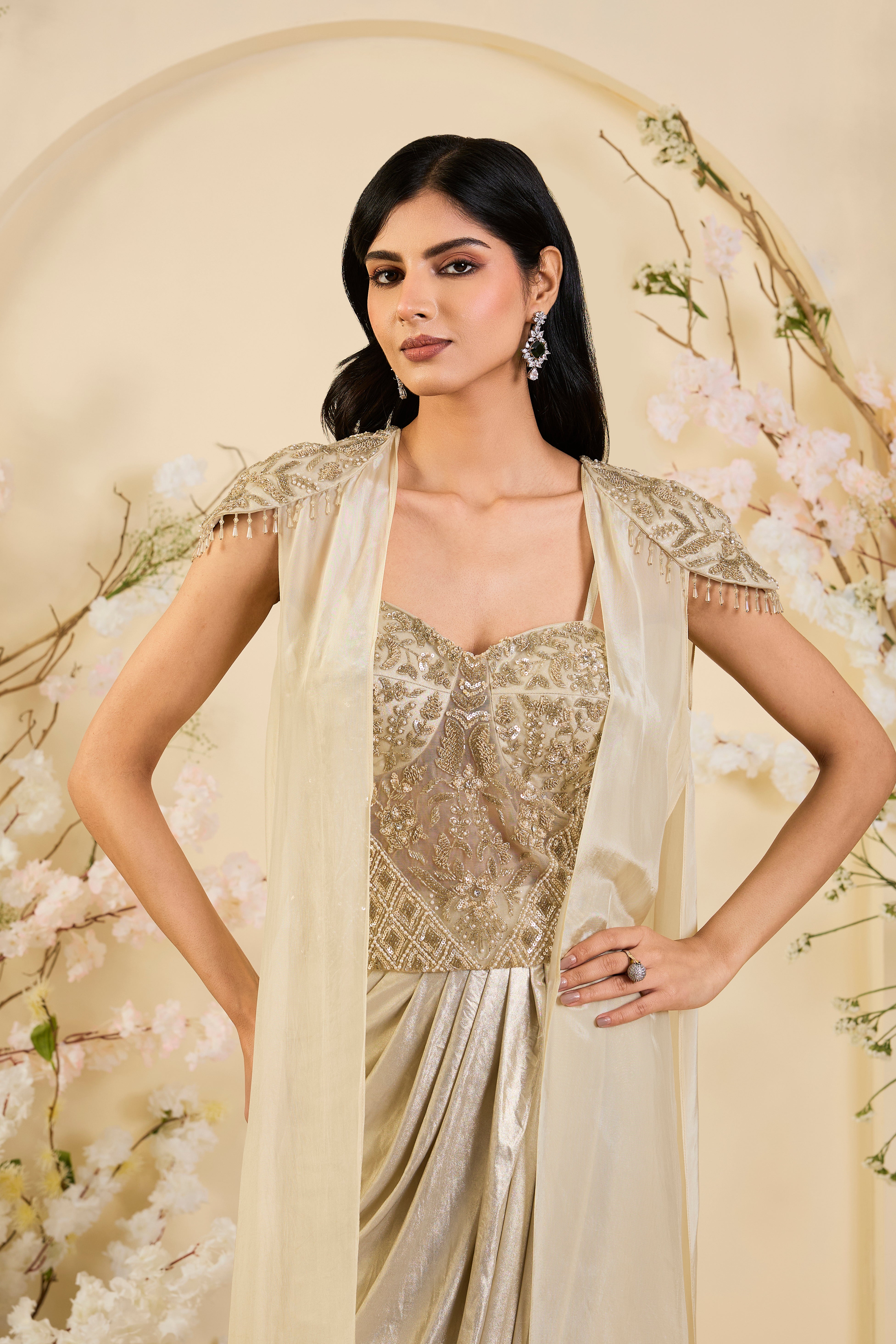 Champagne Drape Saree Gown with Hand-Embellished Corset Bodice & Sheer Cape Elegance