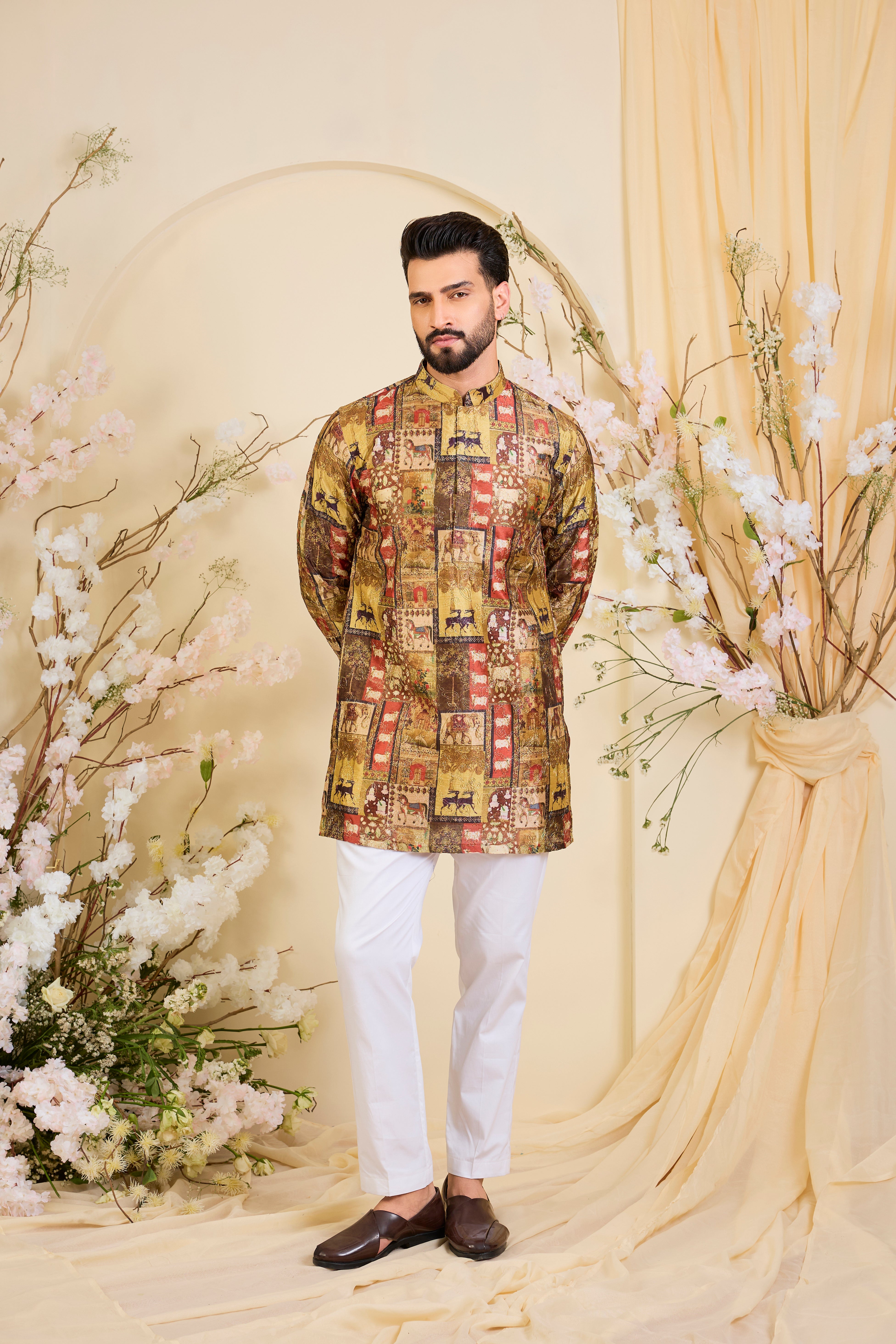 Multicoloured kurta with intricately detailed animal prints, elevated by fine zari embroidery. A bold expression of storytelling through craft.