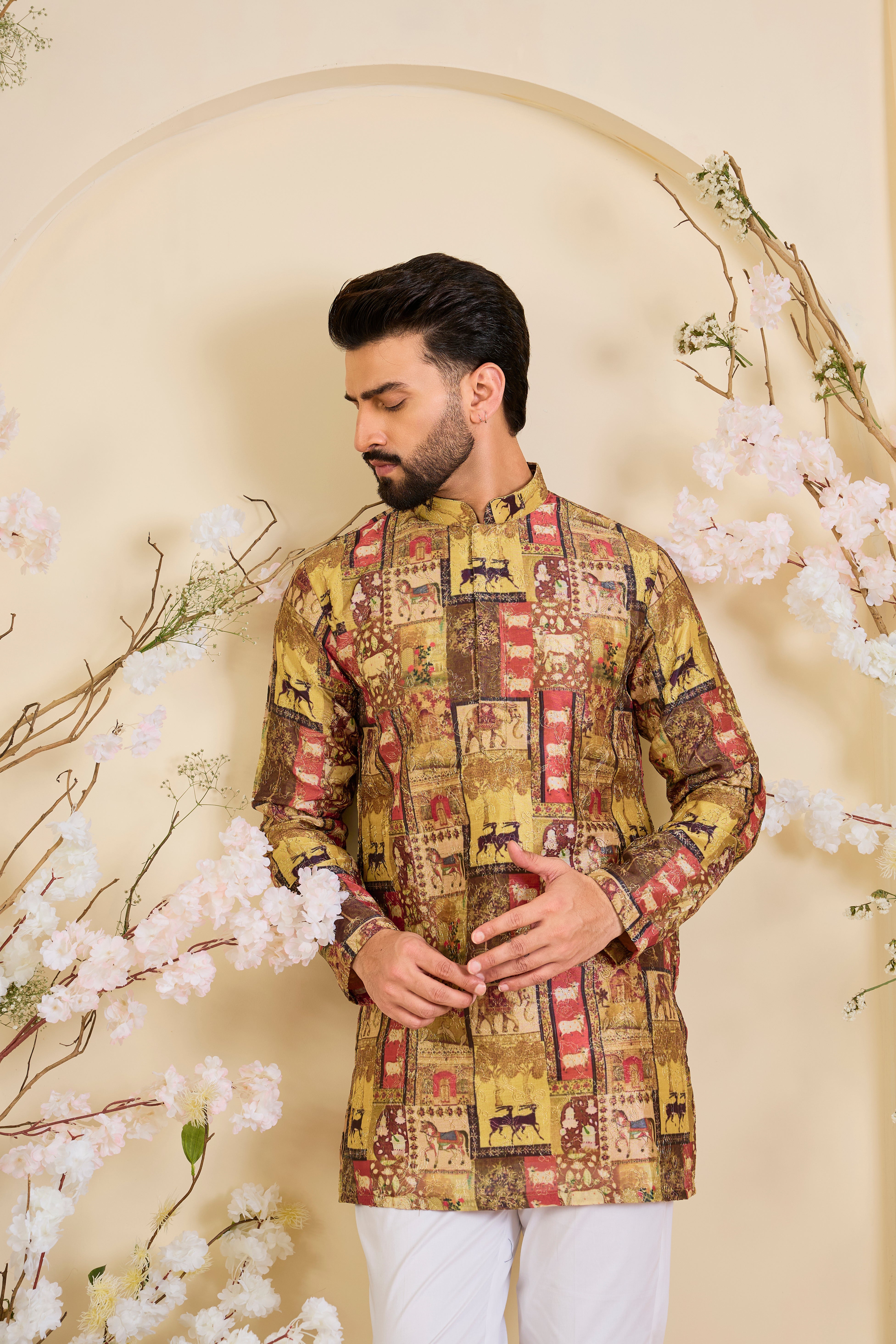 Multicoloured kurta with intricately detailed animal prints, elevated by fine zari embroidery. A bold expression of storytelling through craft.