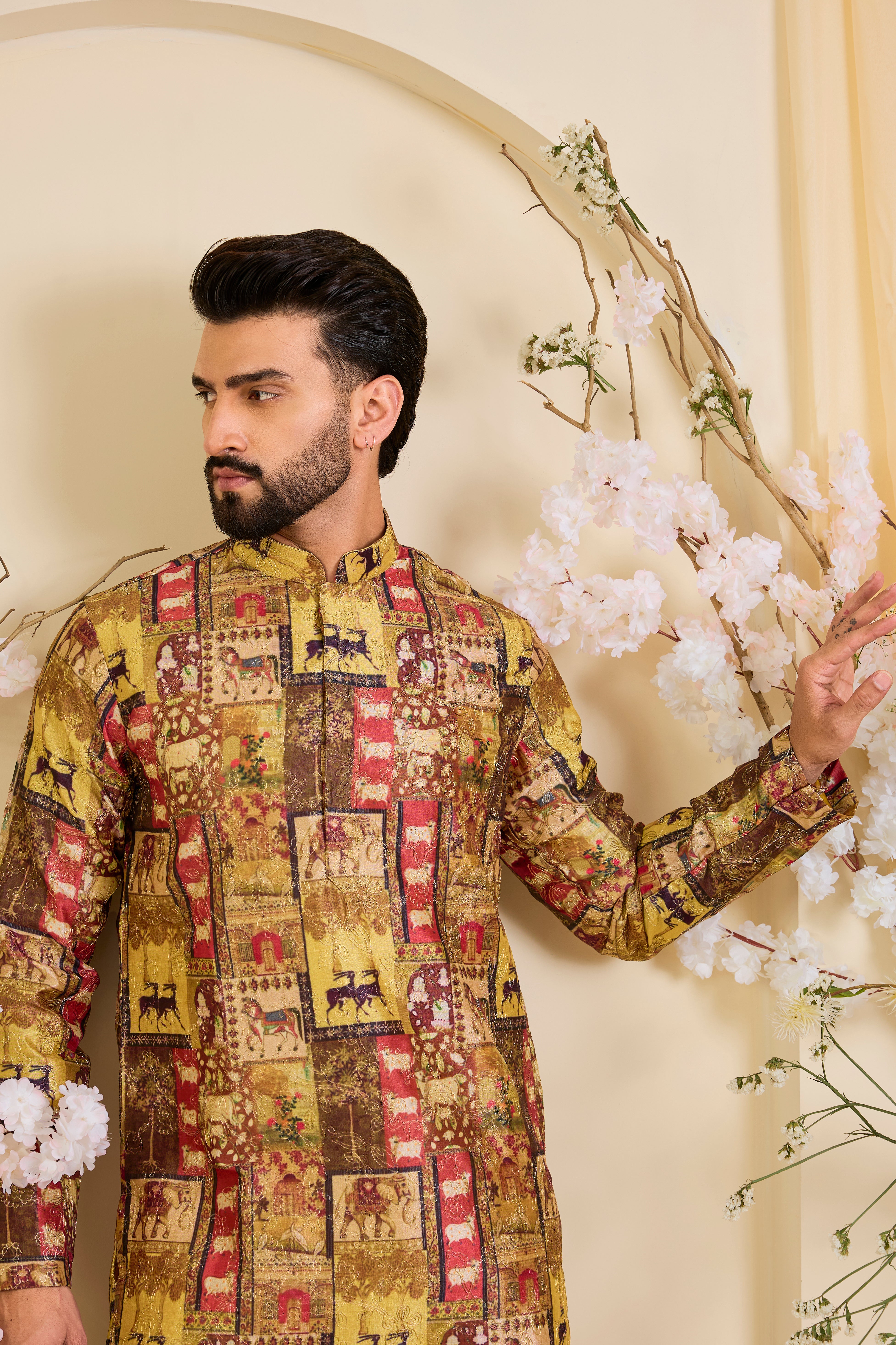 Multicoloured kurta with intricately detailed animal prints, elevated by fine zari embroidery. A bold expression of storytelling through craft.
