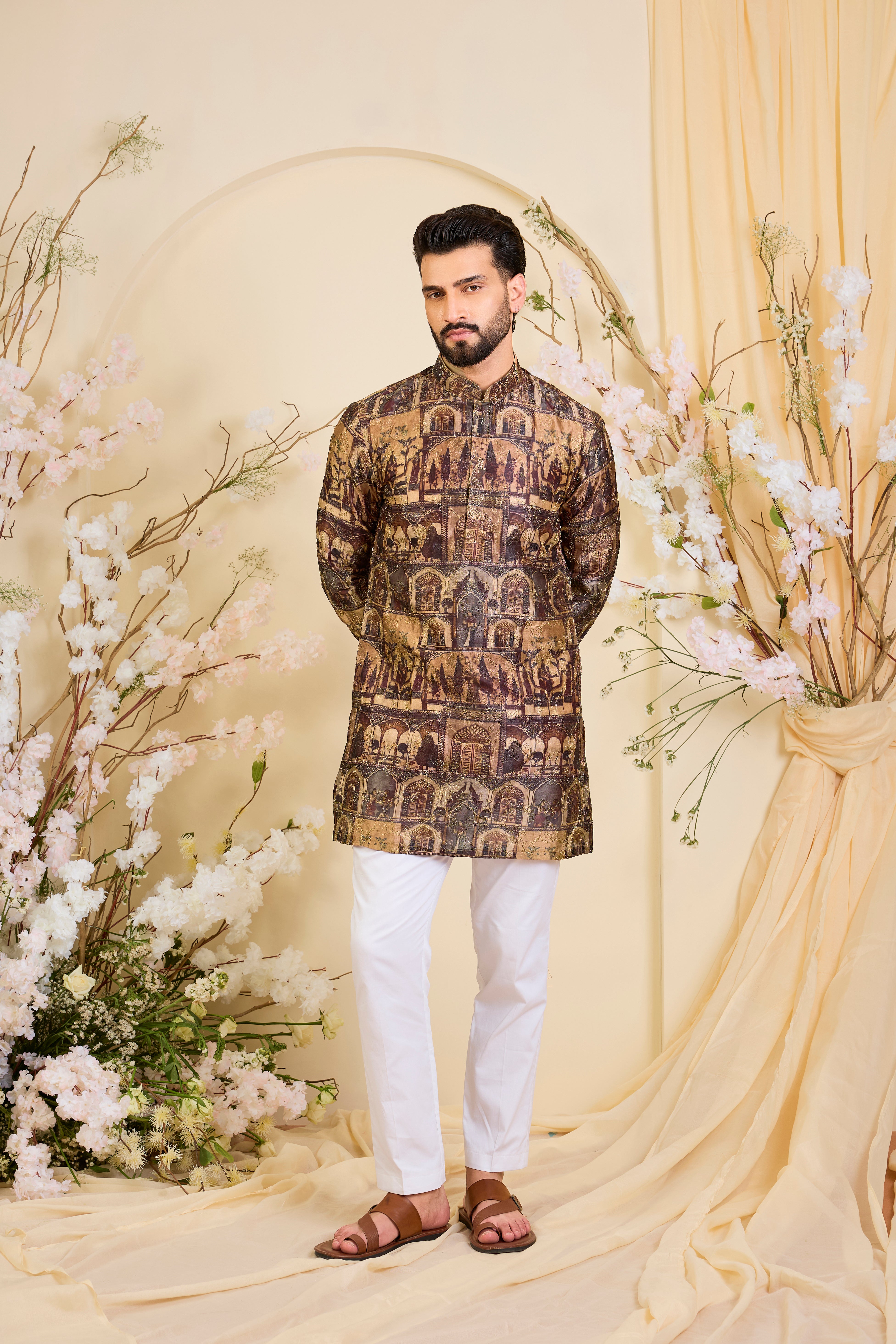 Brown kurta featuring detailed Mughal darbar scenes, enriched with intricate prints and fine aari embroidery. A tribute to royal heritage.