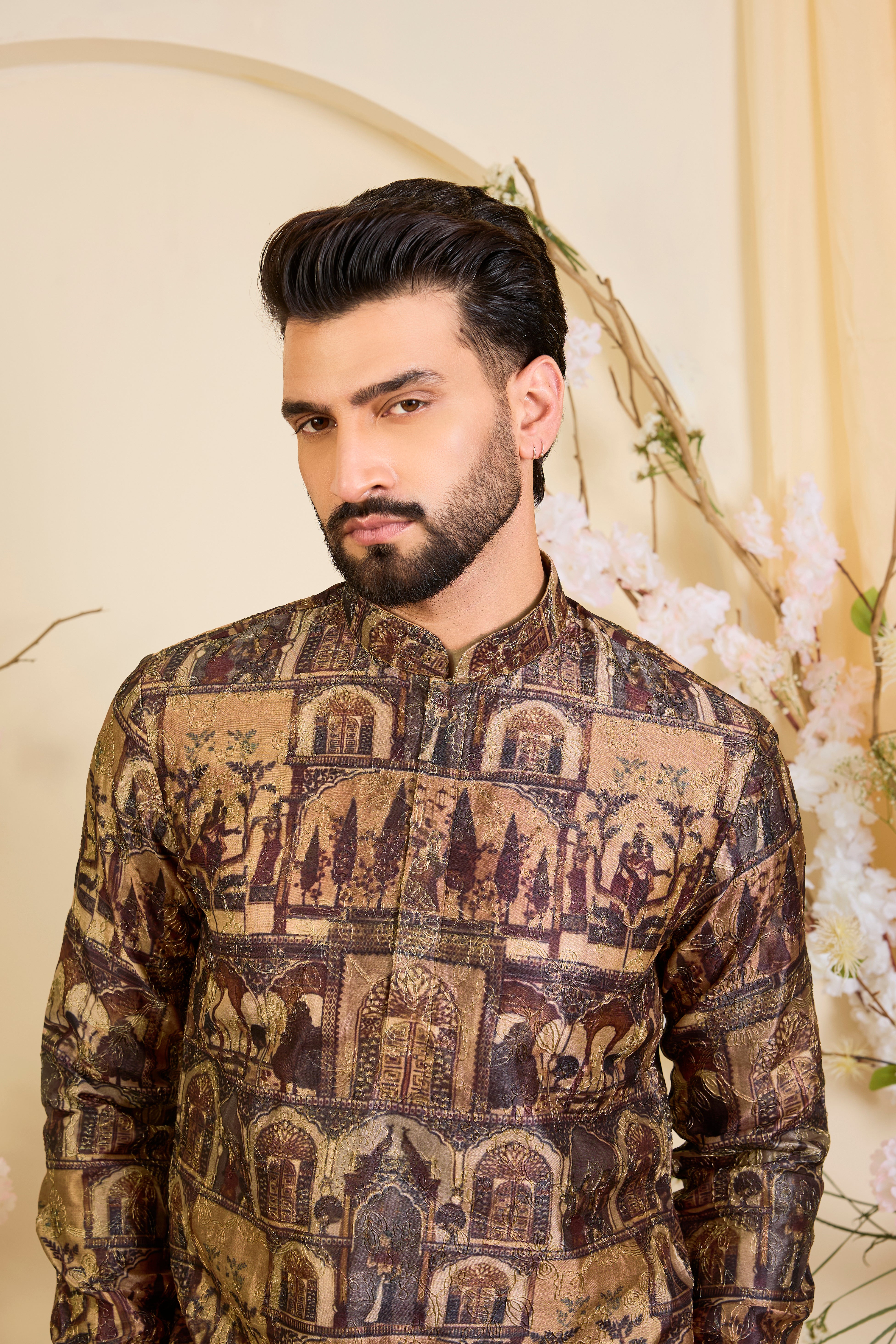 Brown kurta featuring detailed Mughal darbar scenes, enriched with intricate prints and fine aari embroidery. A tribute to royal heritage.