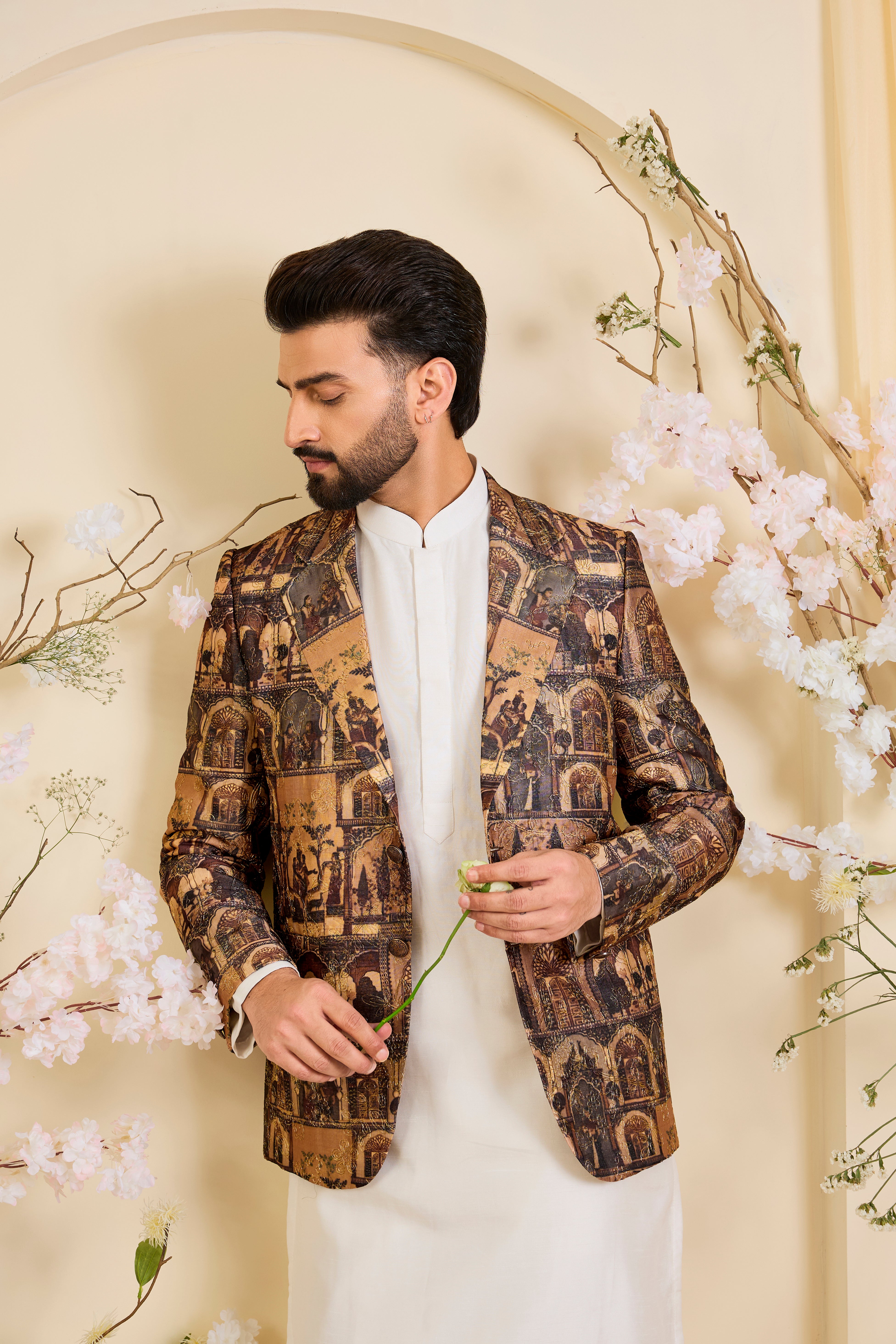 Brown blazer featuring detailed Mughal figures and courtly scenes, elevated with fine aari embroidery for a refined, heritage-rich expression.