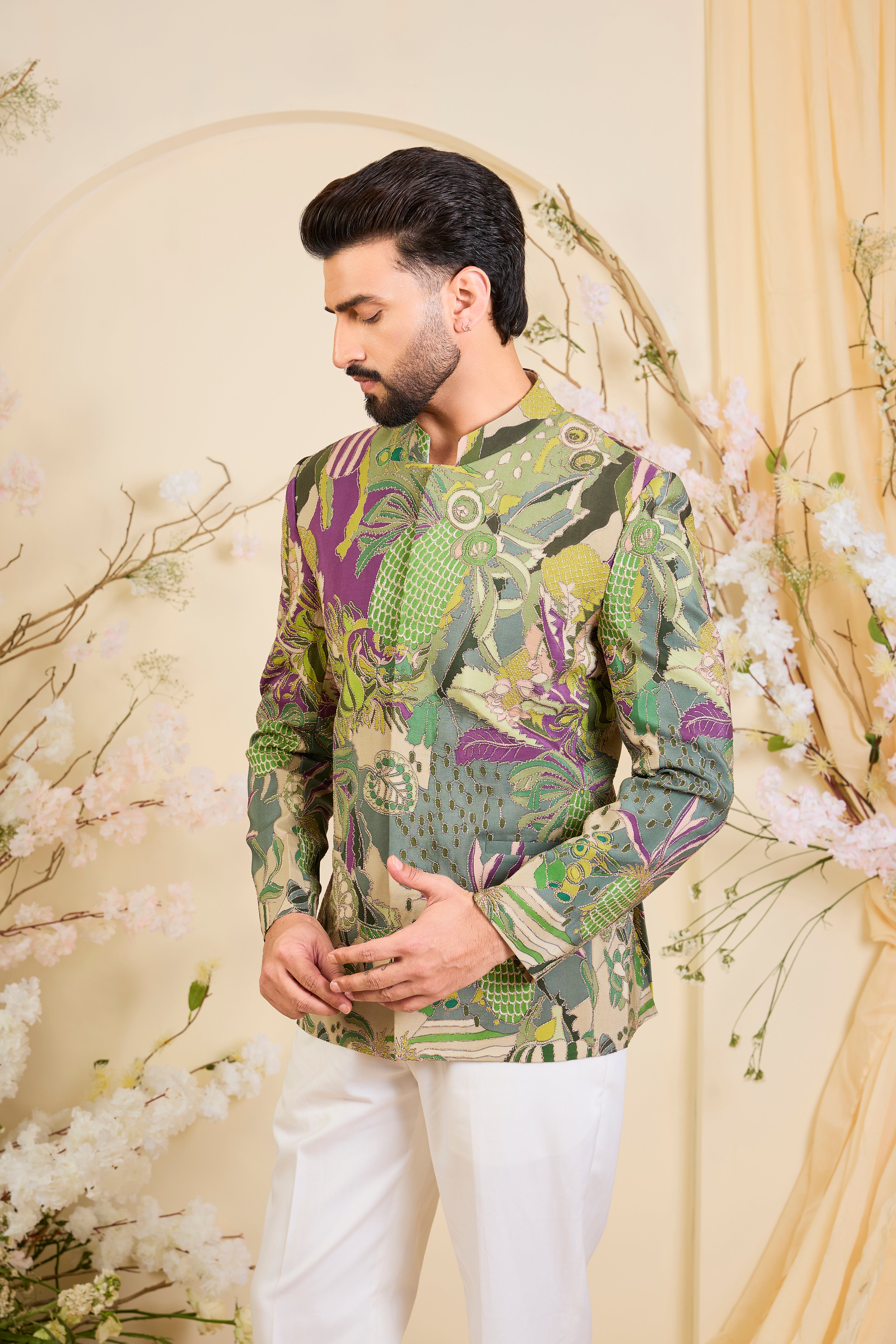 Green abstract bandhgala with detailed multicolour prints and intricate zari accents, blending artistic expression with refined, modern elegance.