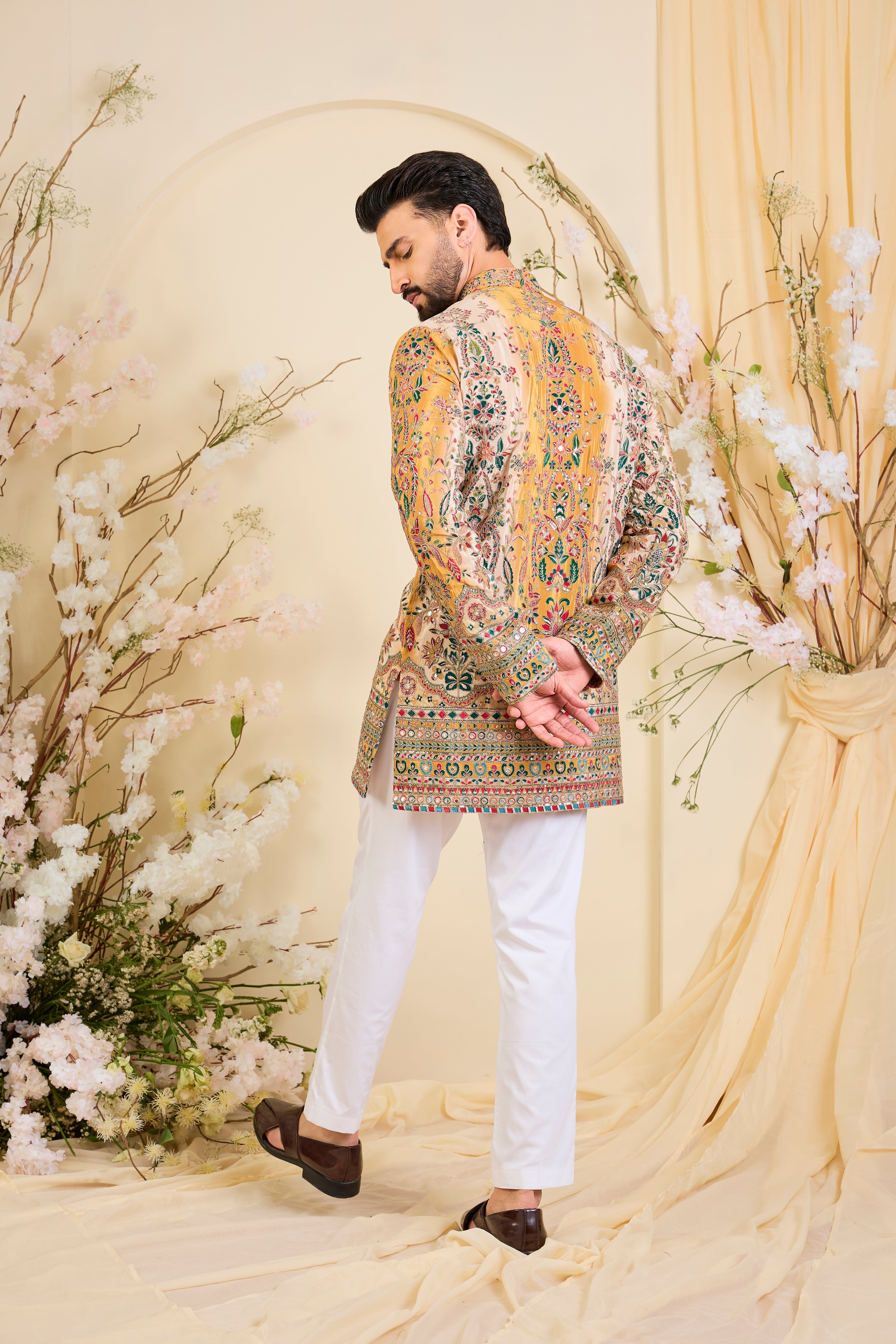 Mustard crepe short kurta with intricate zari work, vibrant multicolour prints, and refined sequin detailing.