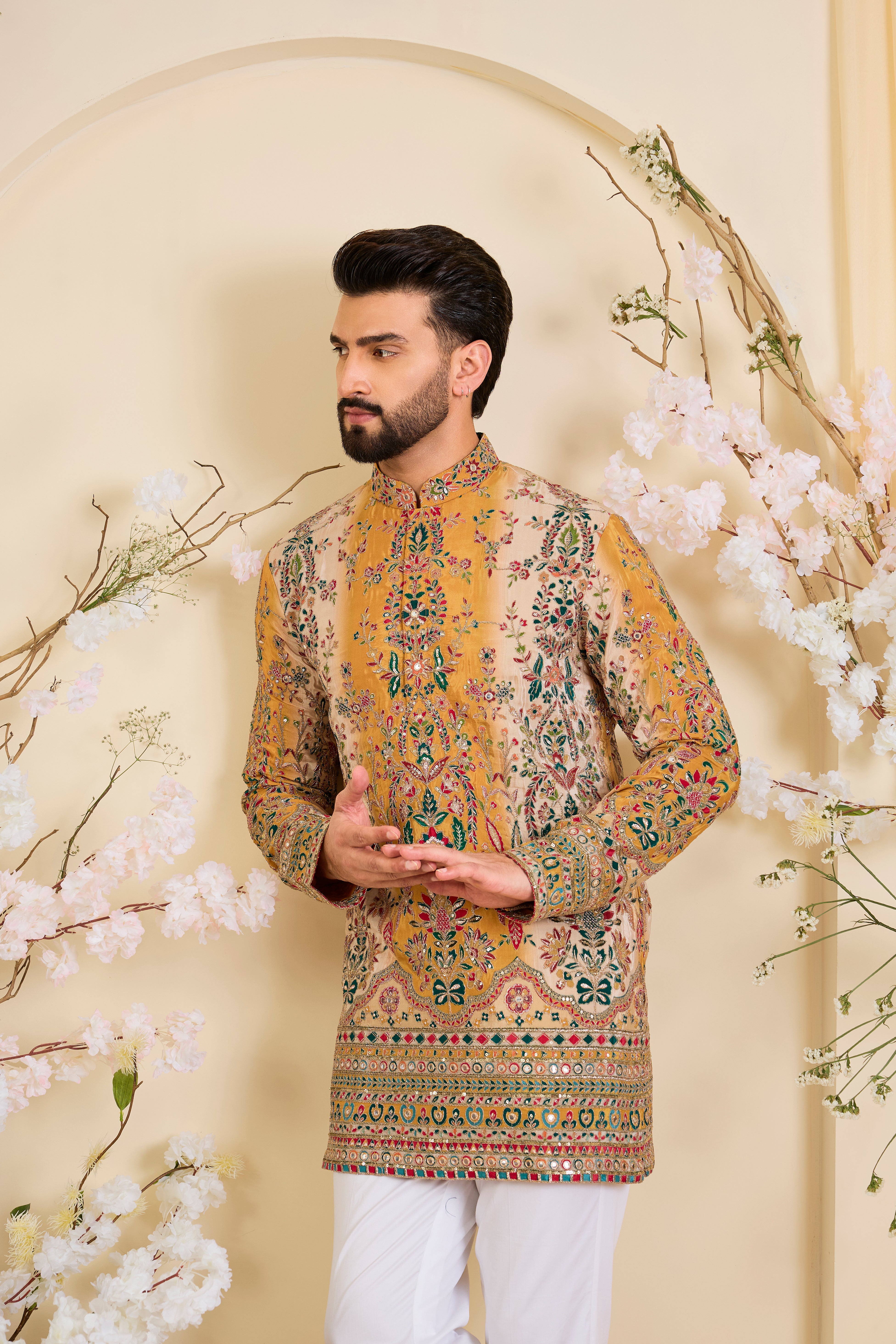 Mustard crepe short kurta with intricate zari work, vibrant multicolour prints, and refined sequin detailing.