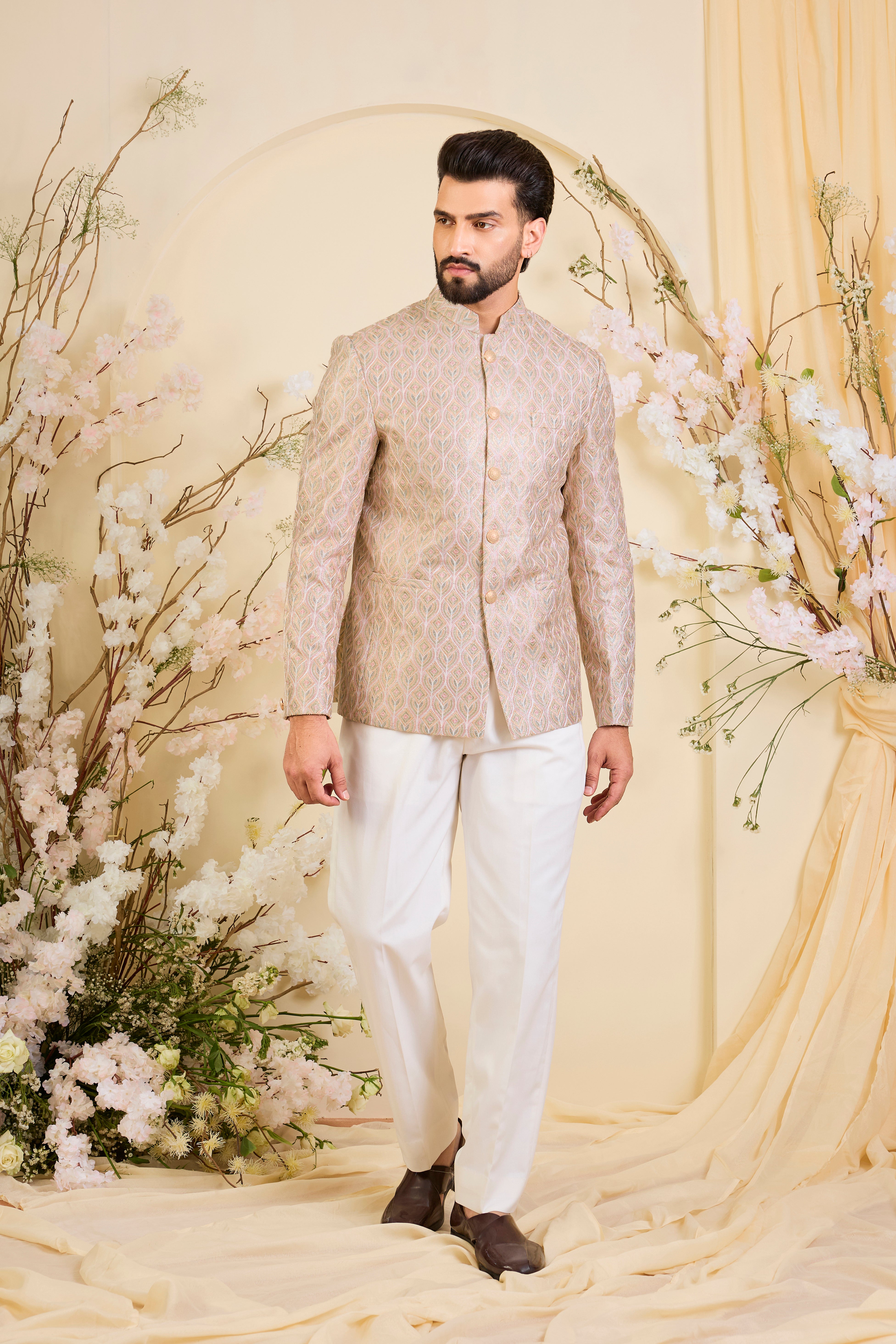 Multicoloured short bandhgala with intricate threadwork and delicate, light-catching zari detailing, offering a bold yet refined couture statement.