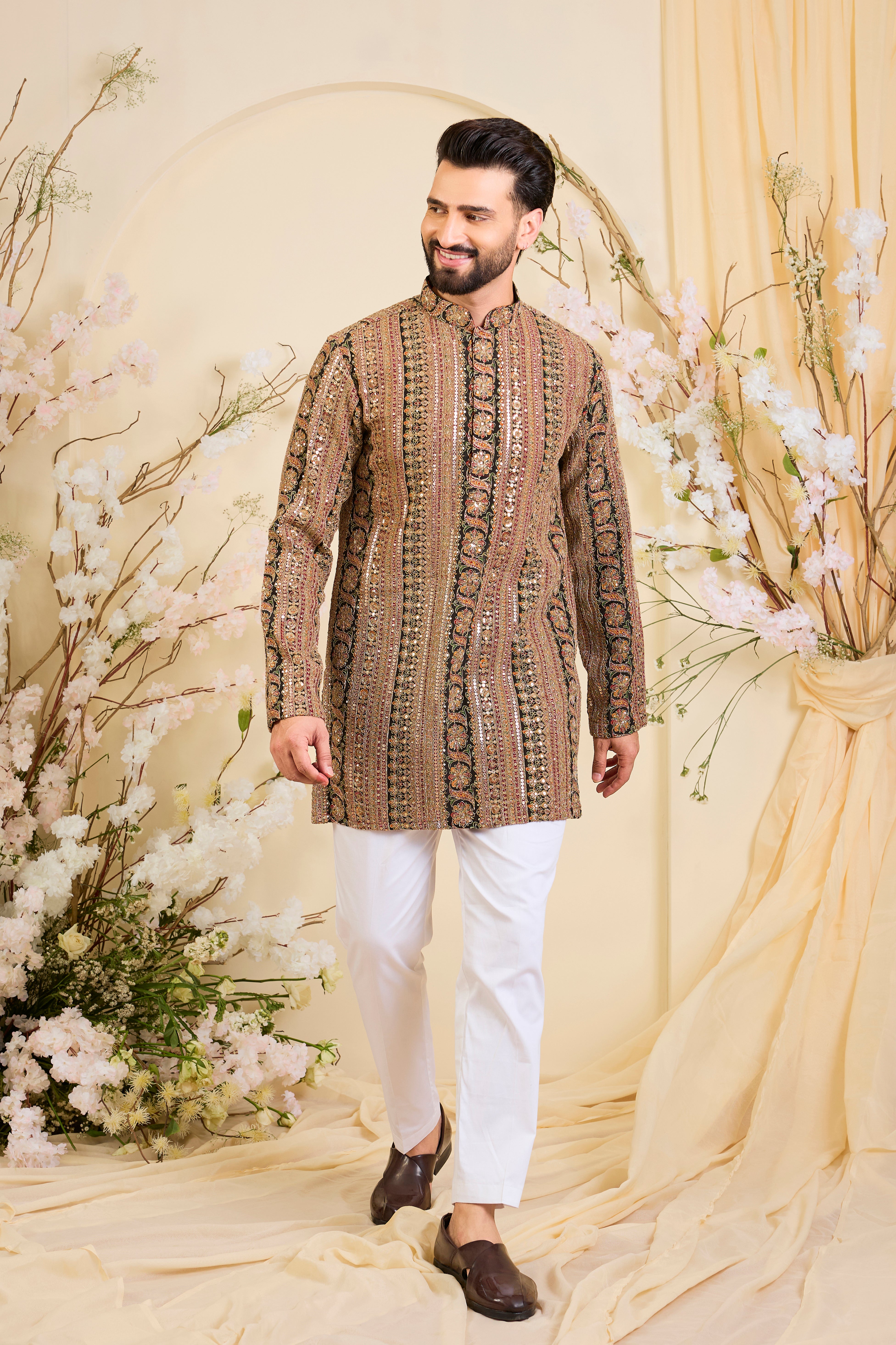 Multicoloured short kurta with heavy zari work and intricate sequin detailing, offering a bold yet refined expression of timeless elegance.