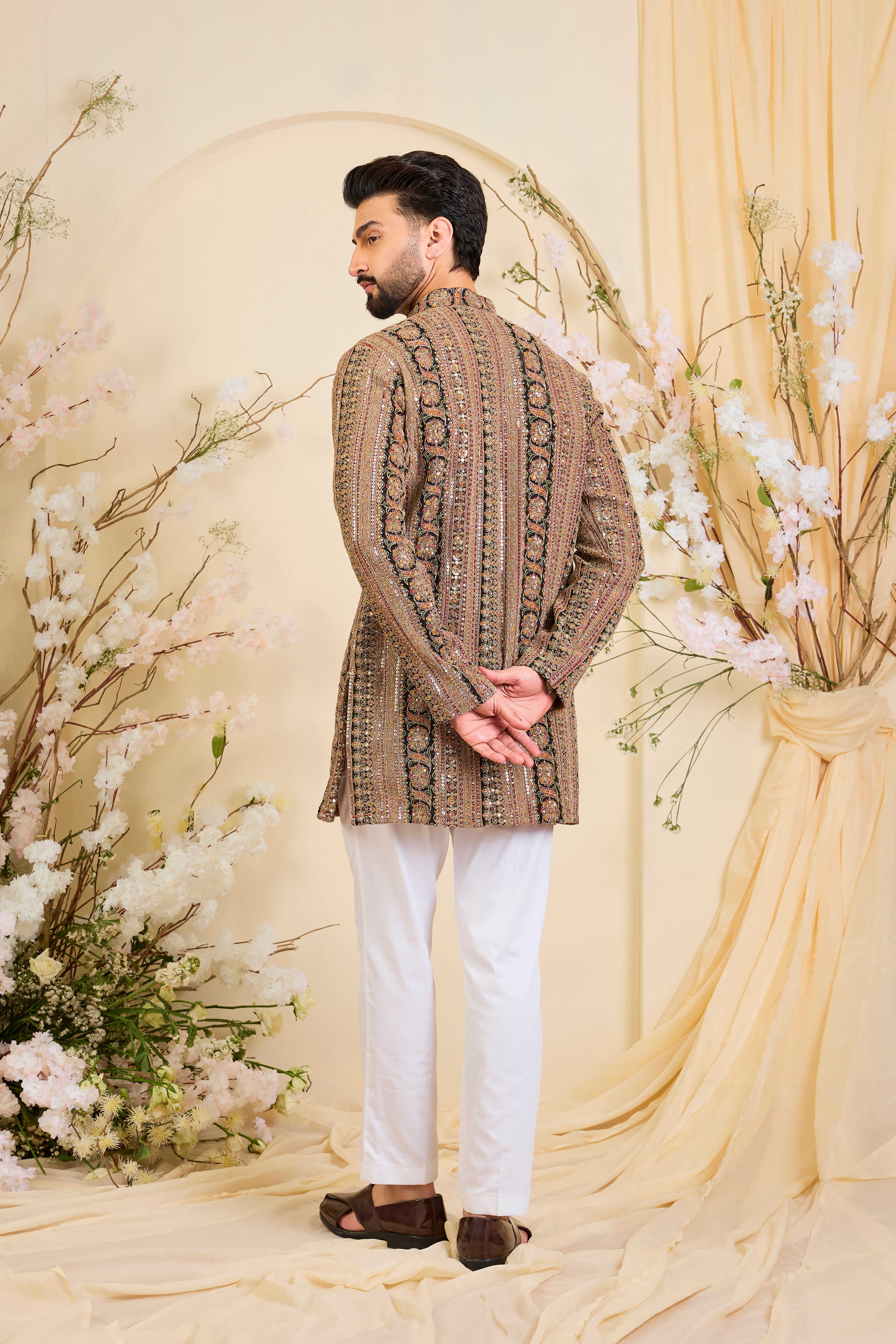 Multicoloured short kurta with heavy zari work and intricate sequin detailing, offering a bold yet refined expression of timeless elegance.