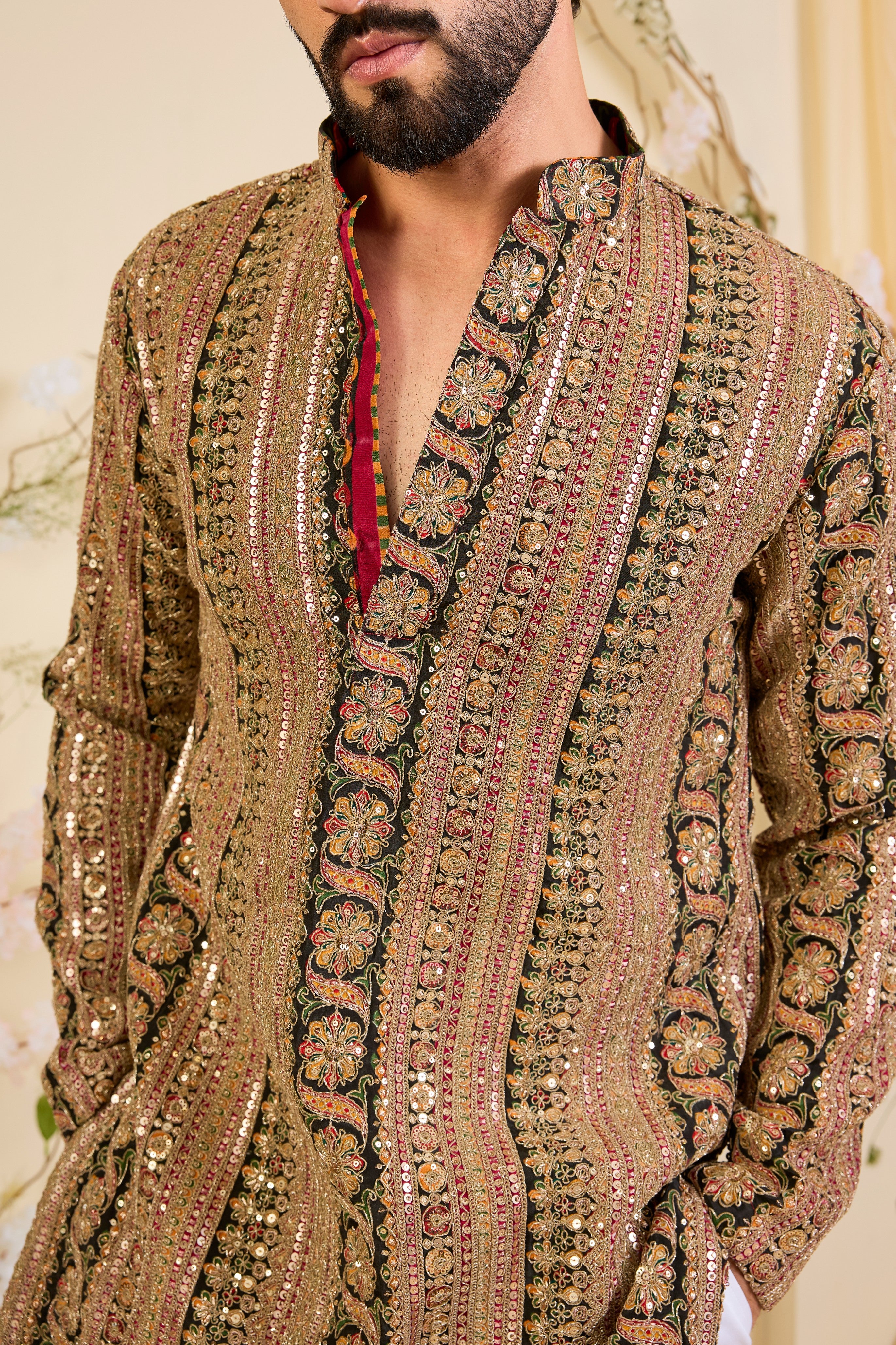 Multicoloured short kurta with heavy zari work and intricate sequin detailing, offering a bold yet refined expression of timeless elegance.