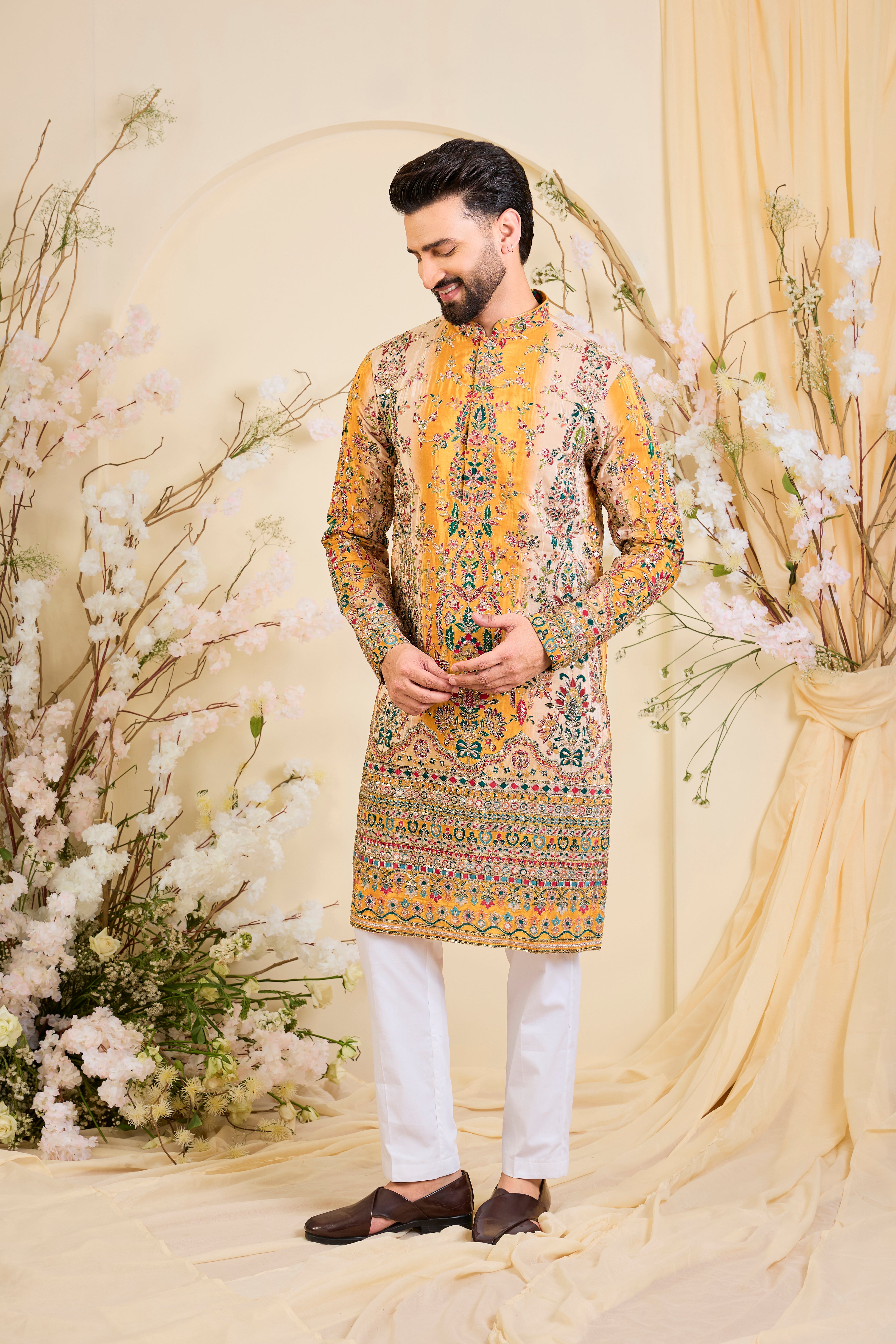 Green crepe kurta with intricate zari work, vibrant multicolour prints, and refined sequin detailing.