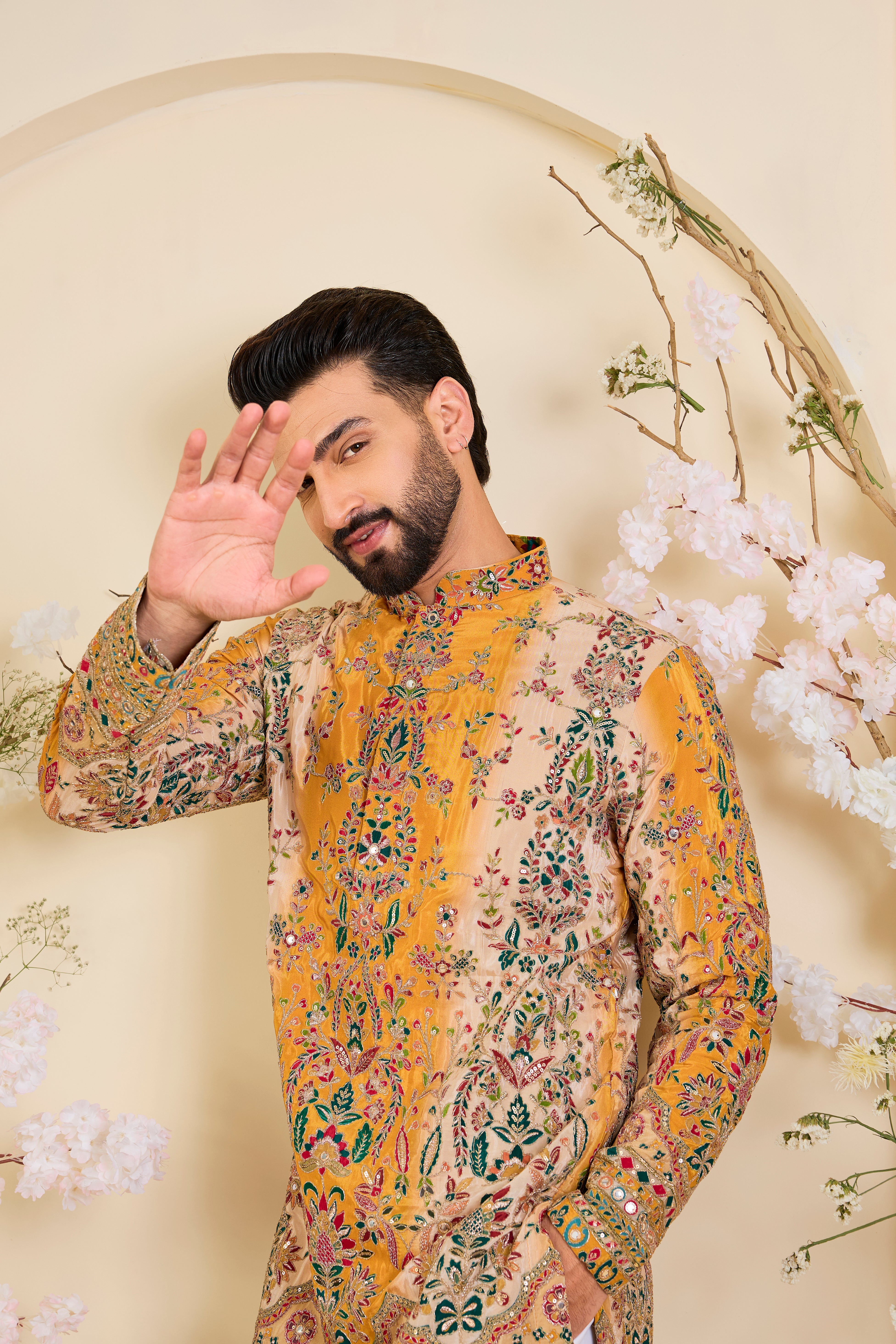 Green crepe kurta with intricate zari work, vibrant multicolour prints, and refined sequin detailing.