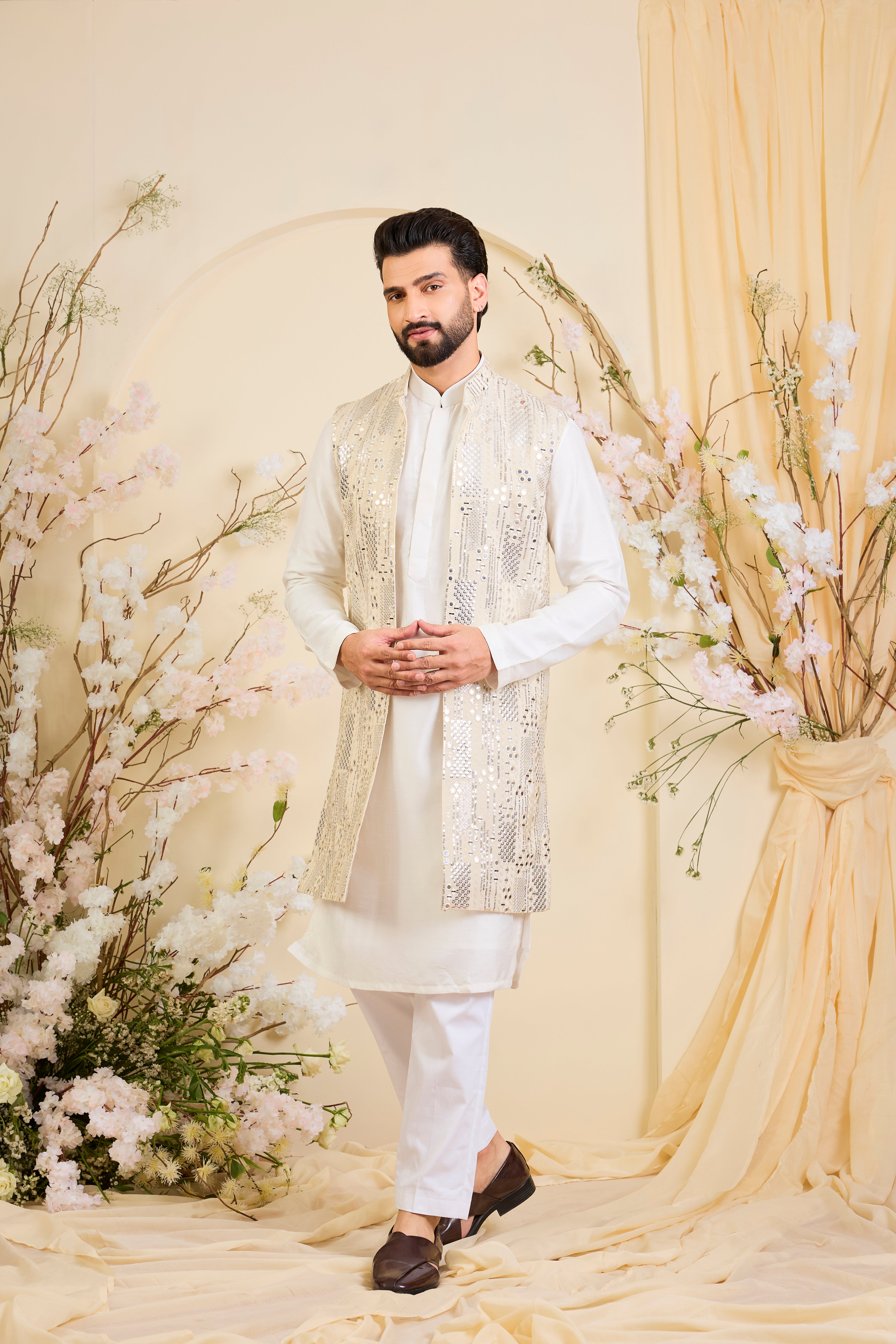 Crafted in luminous tissue, this long open jacket is intricately detailed with sequin mirrorwork, creating a refined illusion of traditional mirrors.