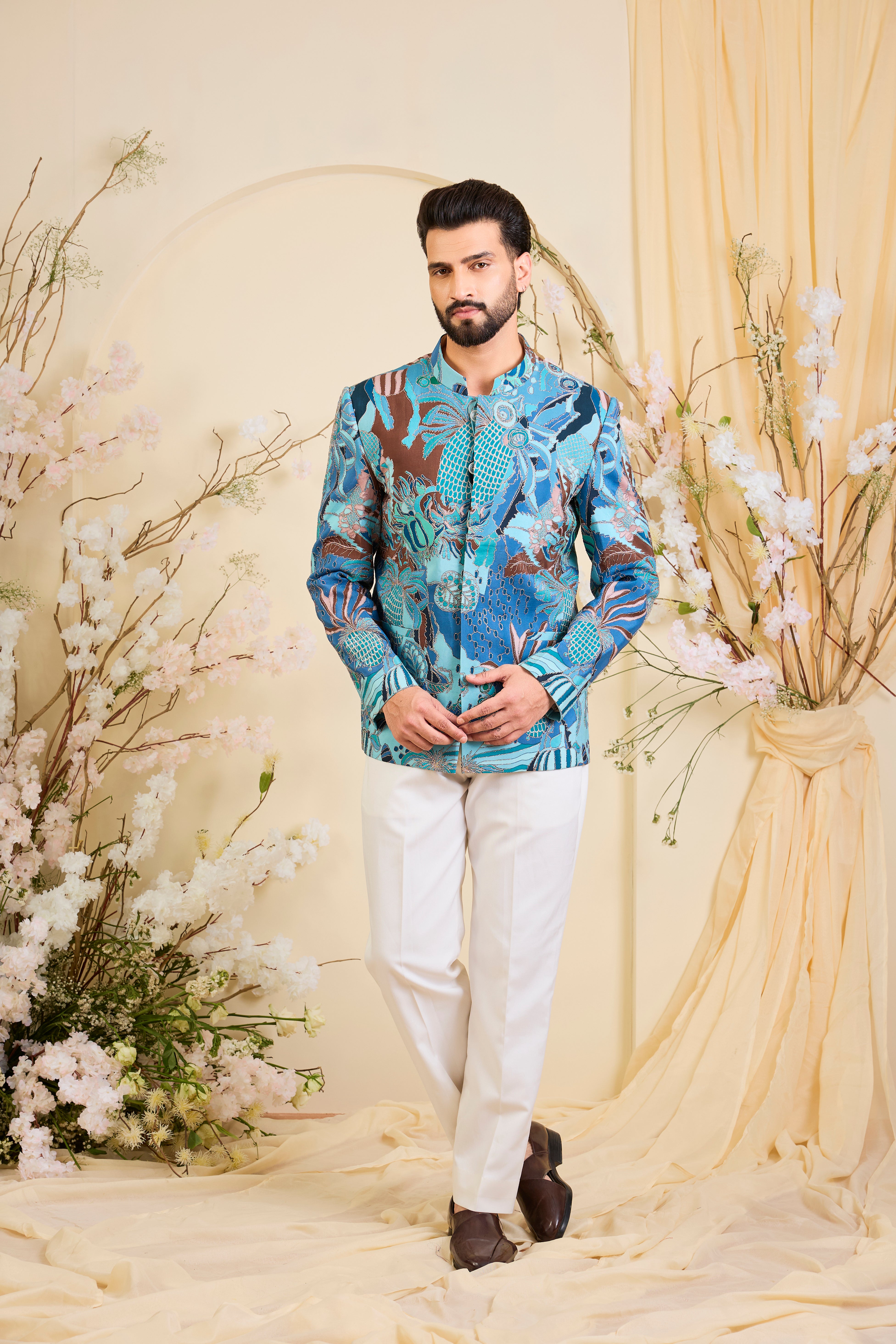 Blue abstract bandhgala with detailed multicolour prints and intricate zari accents, blending artistic expression with refined, modern elegance.