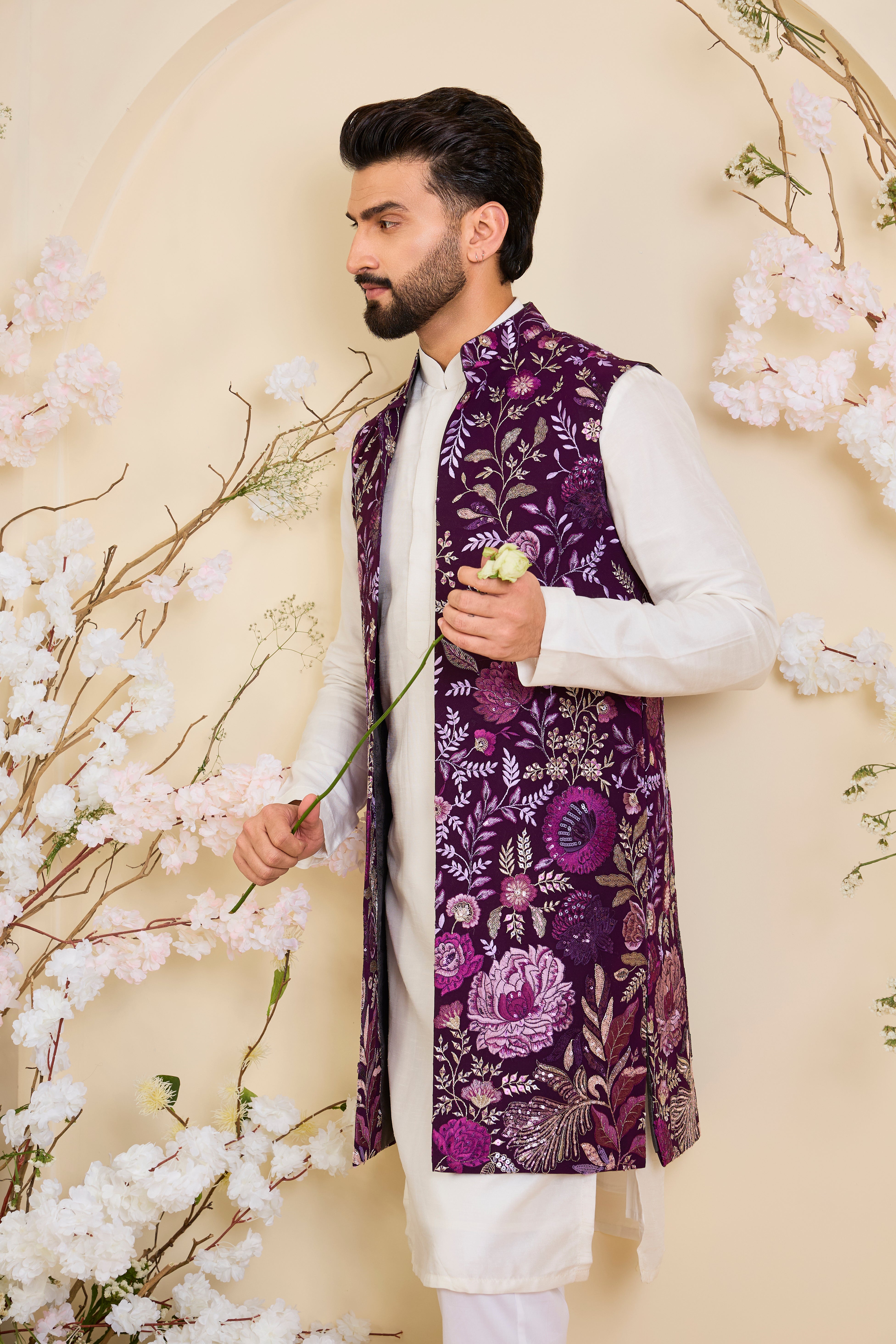 Purple long open jacket with intricate floral patterns in multi thread threadwork, elevated by detailed sequin embellishments for a refined, statement look.