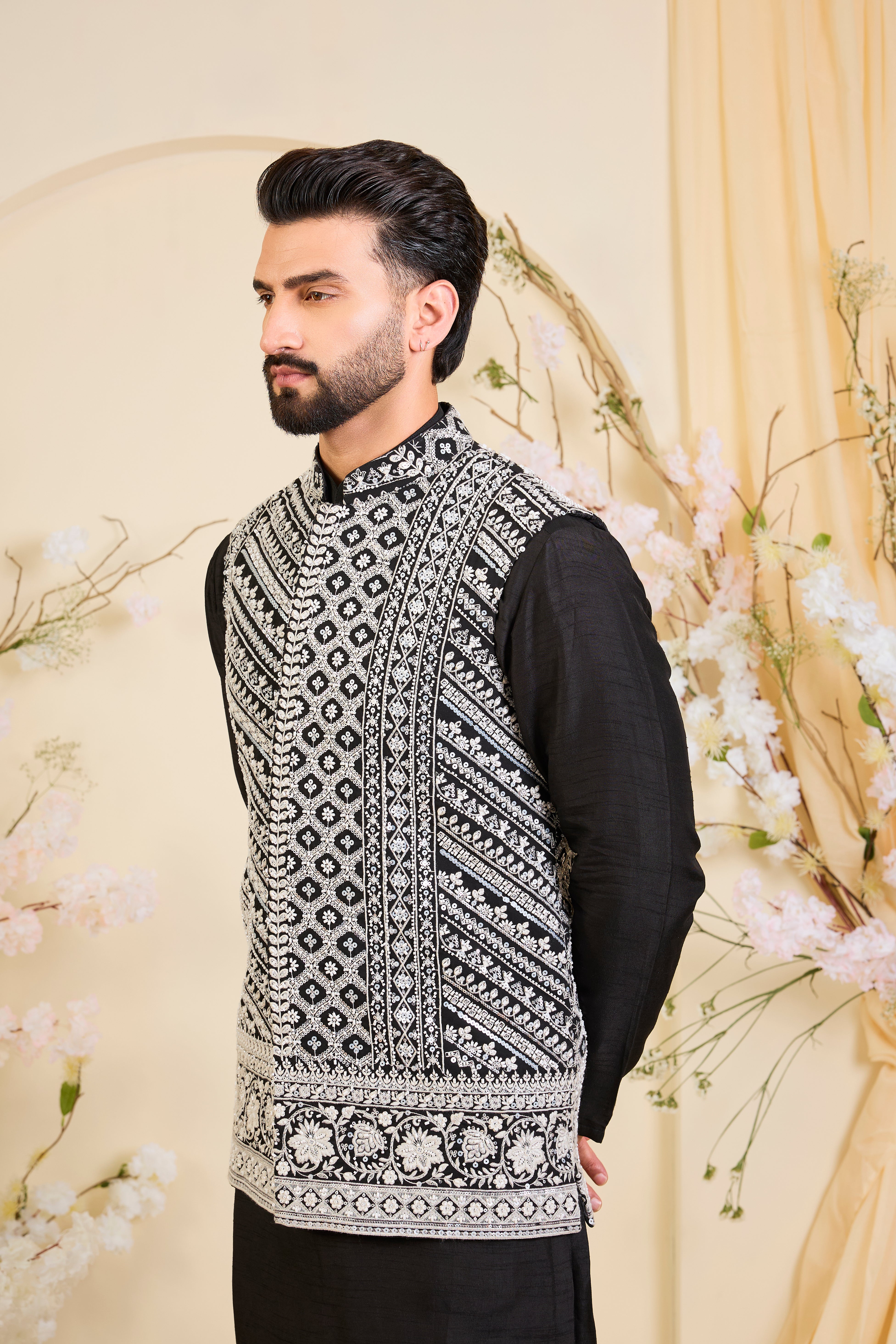Black Nehru jacket with hand embroidery and delicate ivory cut dana work, offering a luminous, and refined couture expression.