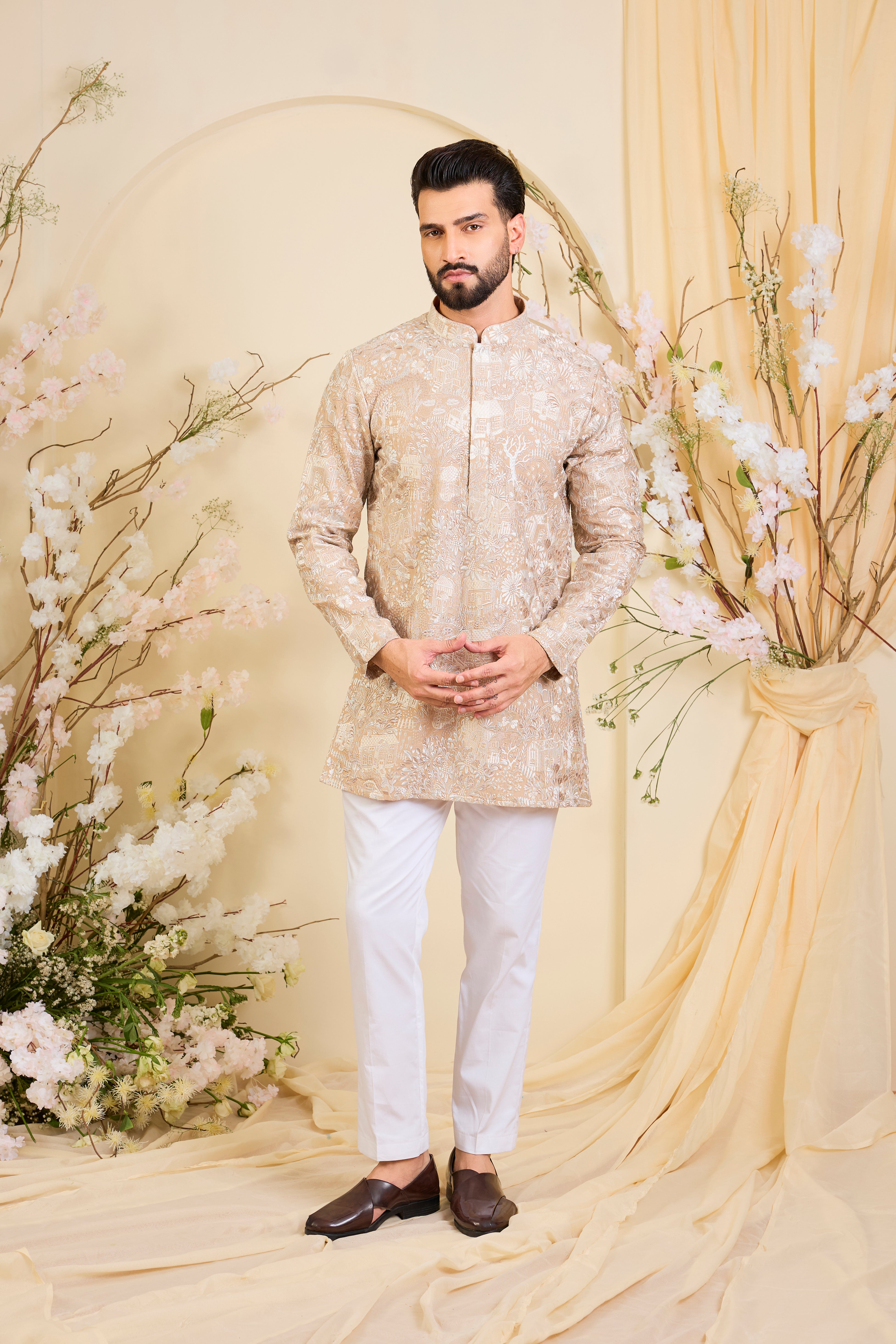 Dark beige/ dust pink short kurta with intricate flora-fauna embroidery and dense threadwork, offering a refined, richly textured couture statement.