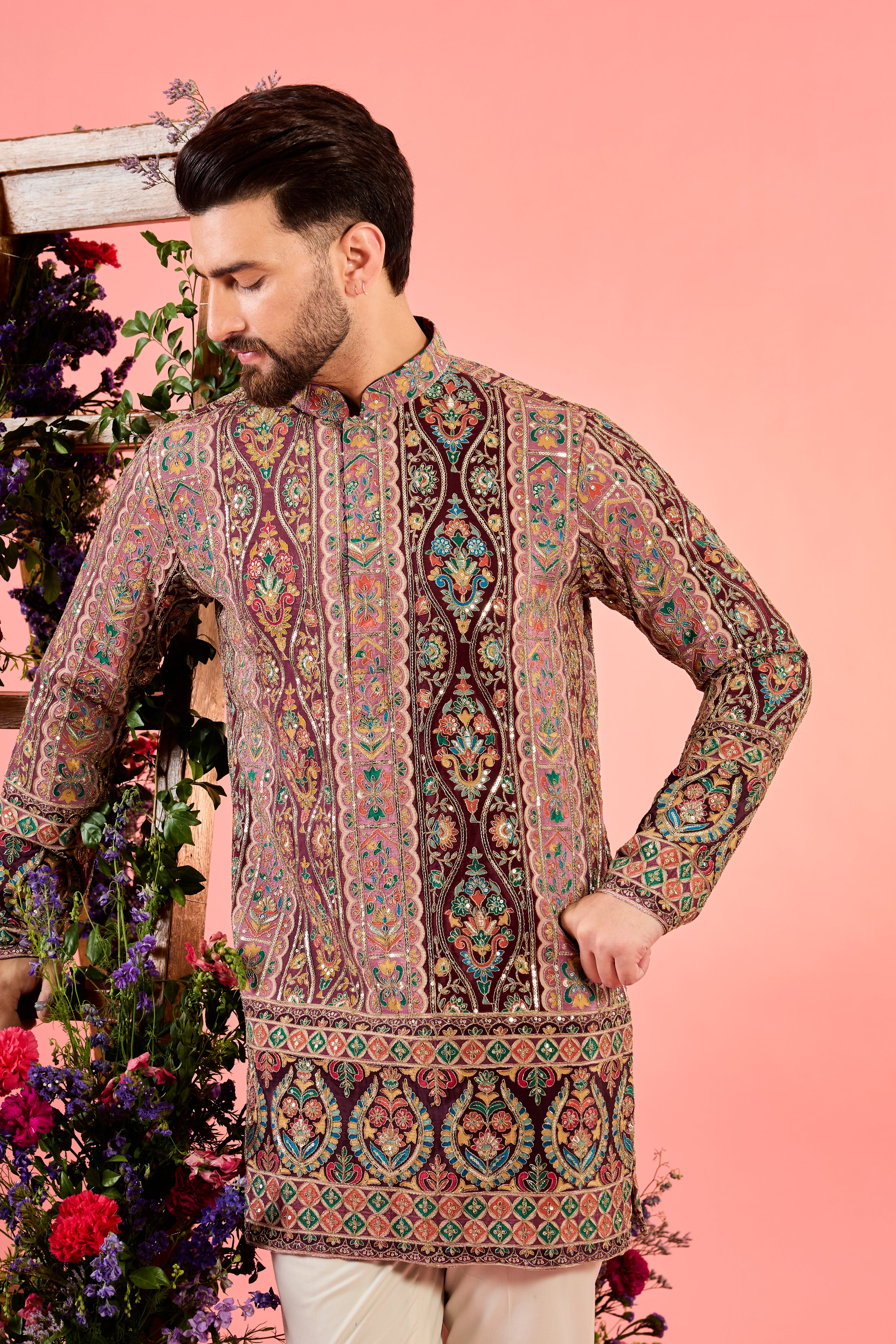 This short kurta is a masterpiece in minimalism, showcasing delicate thread embroidery & mulri coloured thread and aari work