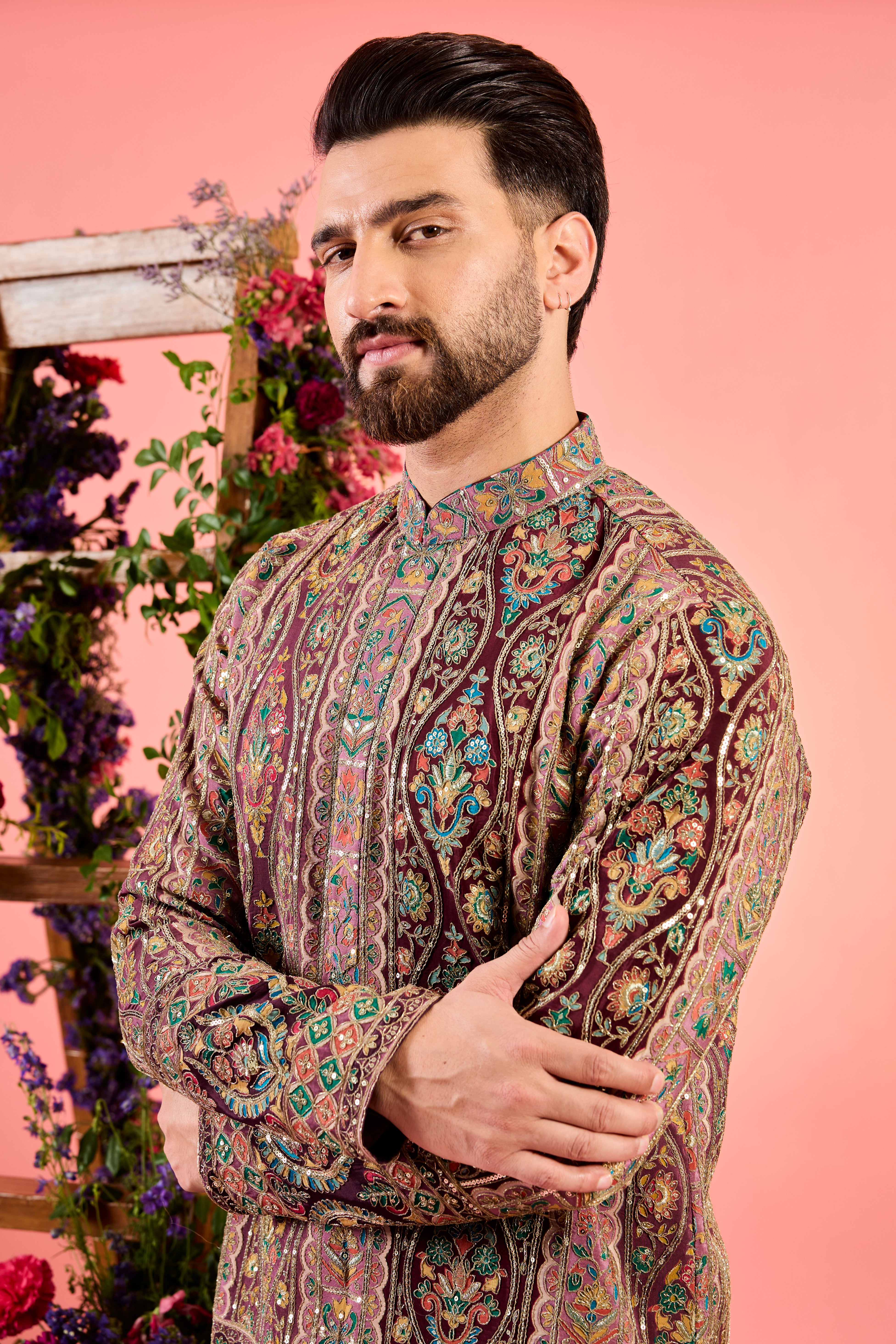 This short kurta is a masterpiece in minimalism, showcasing delicate thread embroidery & mulri coloured thread and aari work