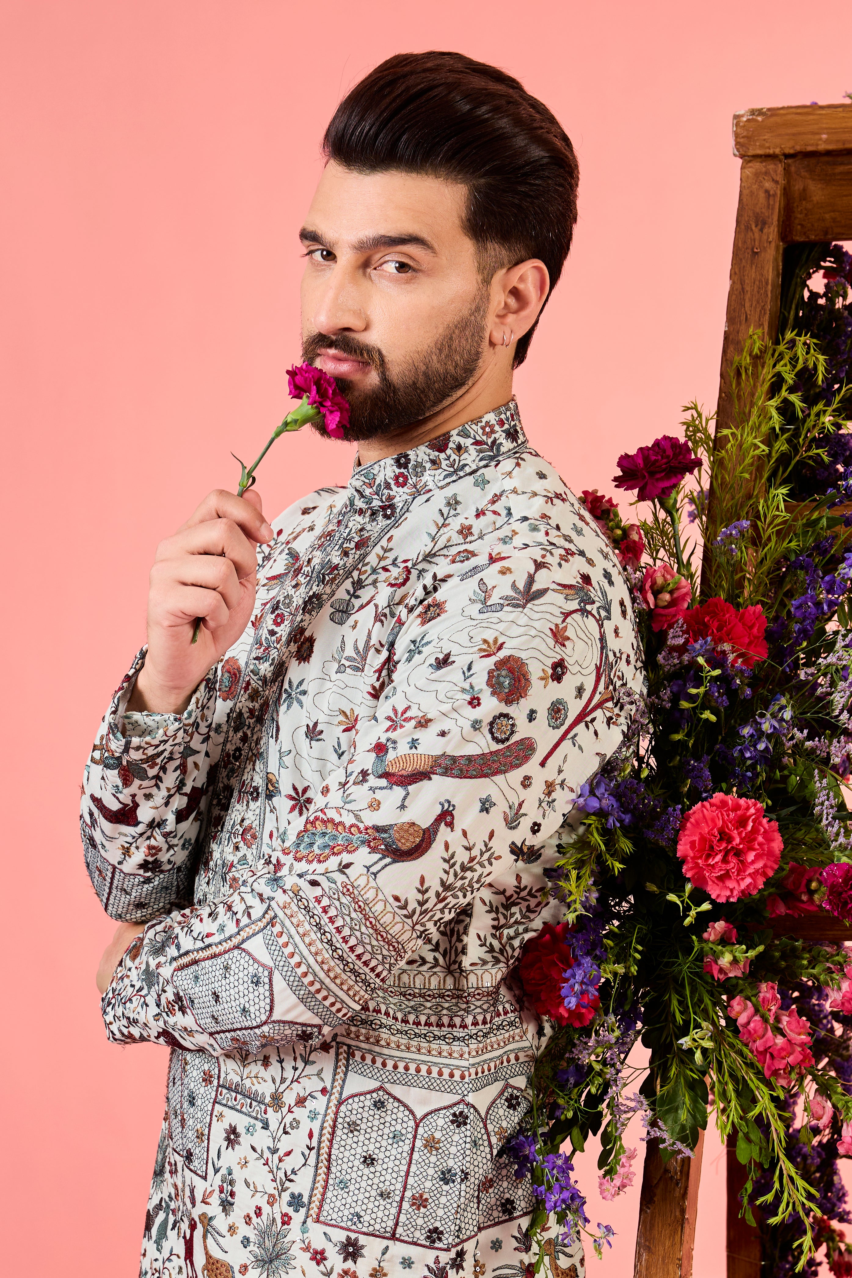 white chikankari kurta with deatiled flora & fauna and intricate neckline